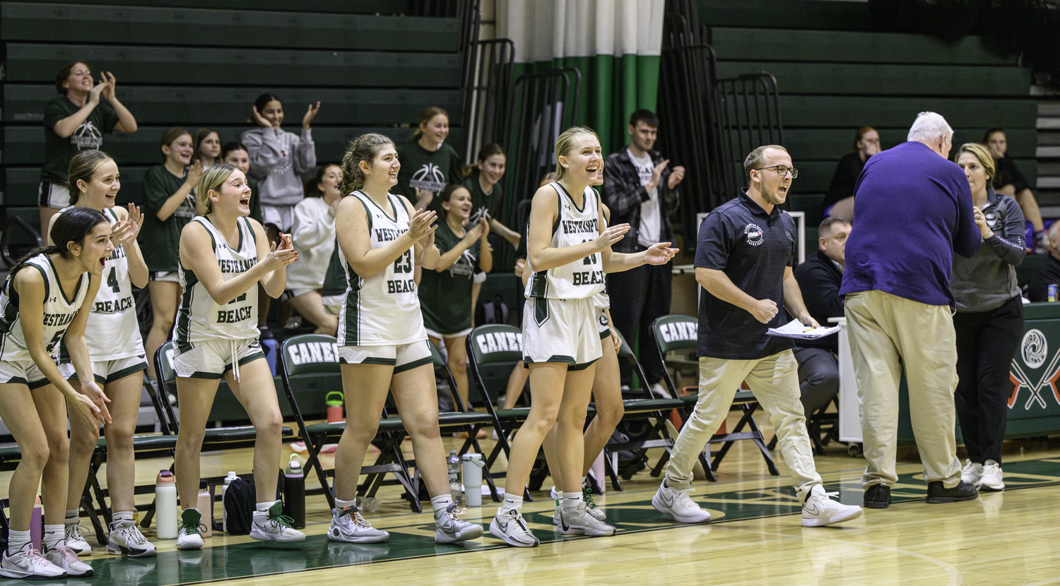 Westhampton Beach's bench celebrates sophomore guard Kate Sweet's game-winning three-pointer. MARIANNE BARNETT