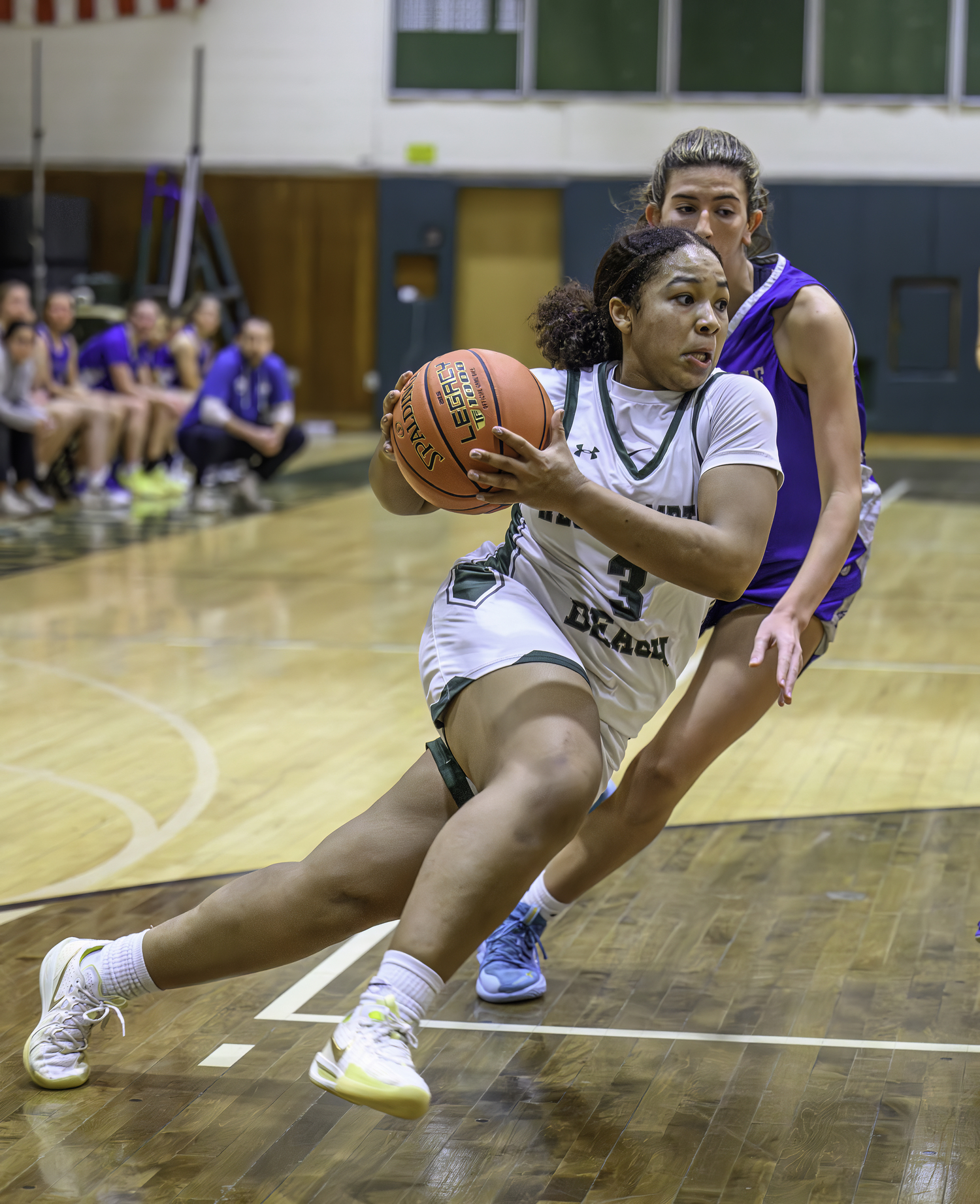 Junior point guard Sandra Clarke moves the ball. MARIANNE BARNETT