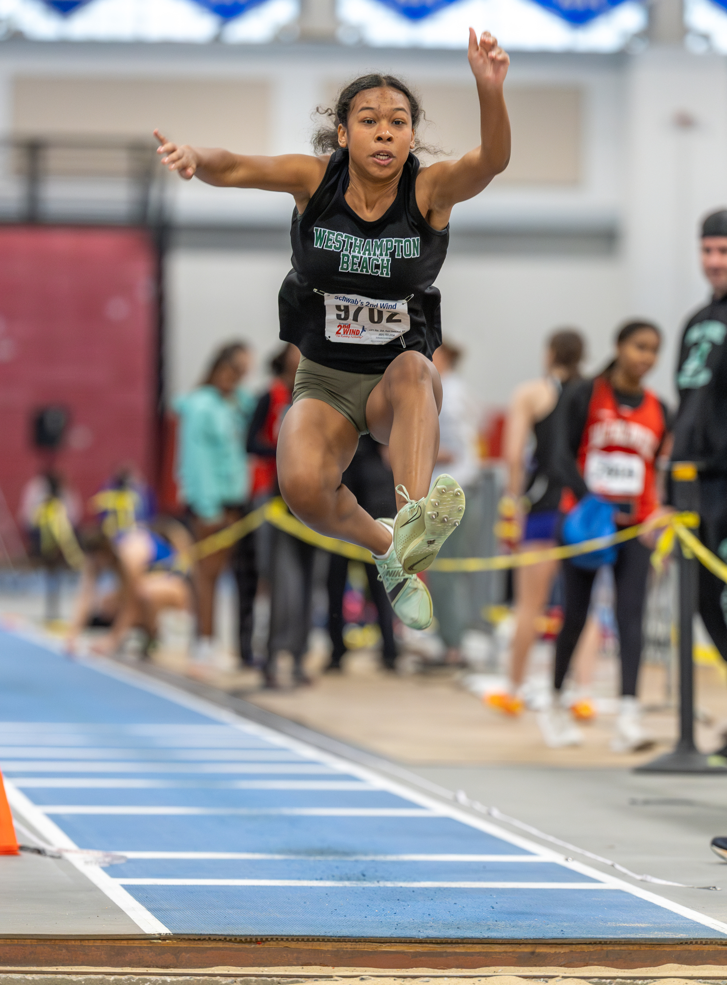 Westhampton Beach senior Mikaling Pantophlet placed third in the long jump.   RON ESPOSITO