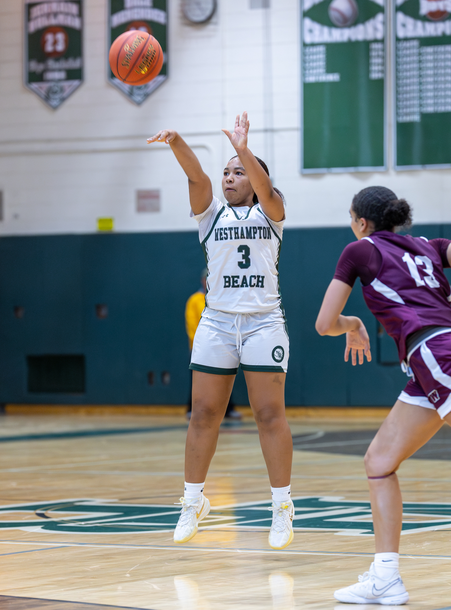 Junior point guard Sandra Clarke lets the ball fly. RON ESPOSITO