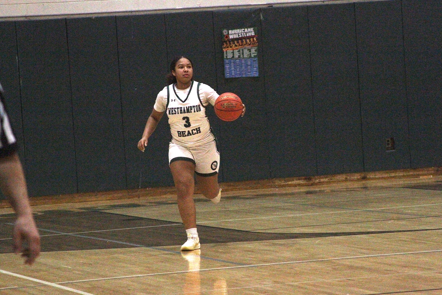 Junior point guard Sandra Clarke carries the ball into play. DESIRÉE KEEGAN