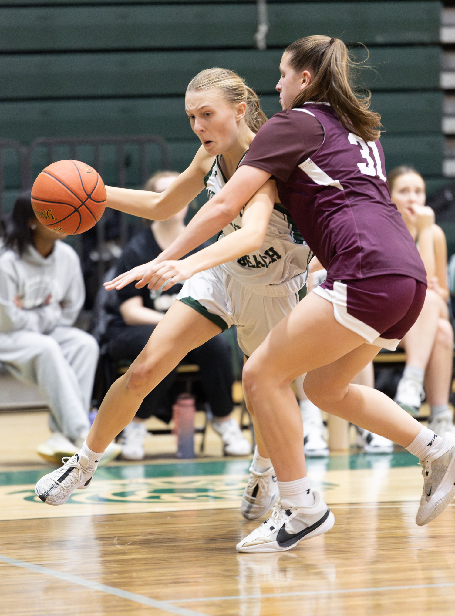 Senior forward Shannon Sweet drives the ball around Walt Whitman's Marisa Castillo. RON ESPOSITO