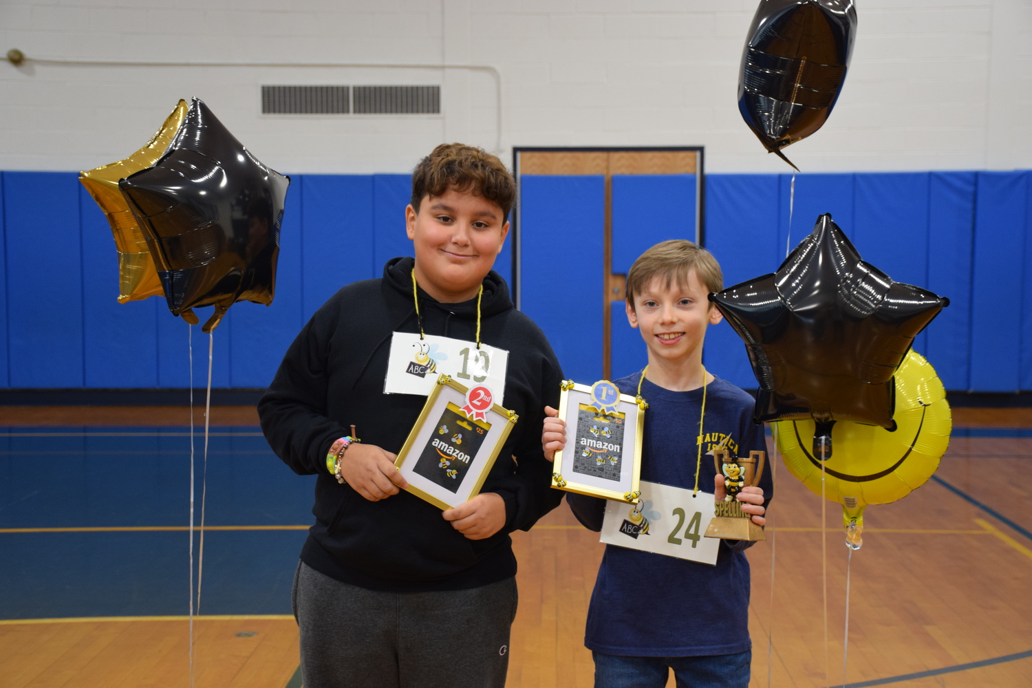 Eastport Elementary School fifth-graders Emil Almeida and Evan Gulde were runner-up and first-place winner, respectively, in the school spelling bee. COURTESY EASTPORT-SOUTH MANOR SCHOOL DISTRICT