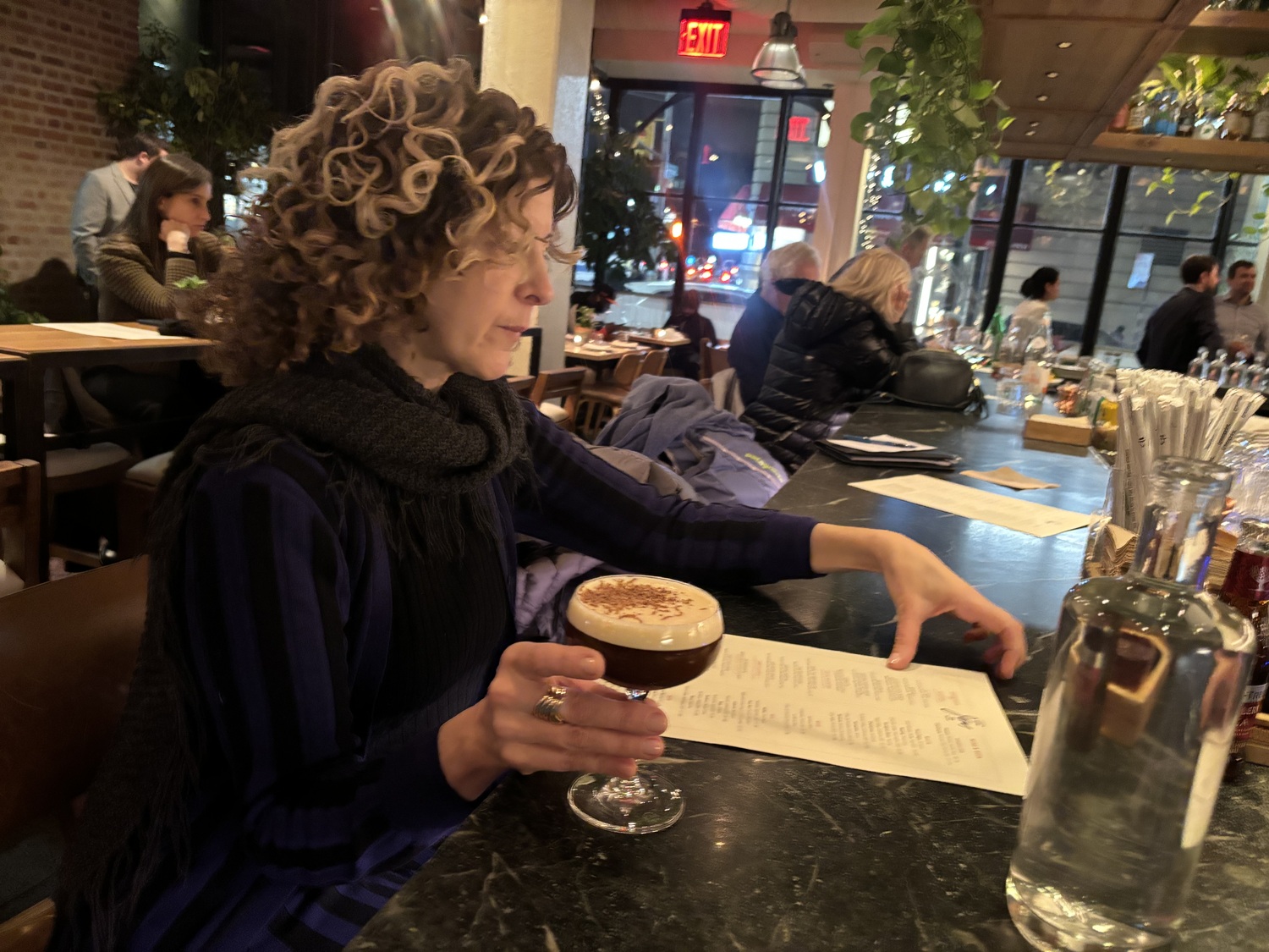 At the farm to table restraint in1 Hotel, patron Deborah Bush does her part to help the planet with an espresso martini, made with repurposed espresso grounds. JENNY NOBLE