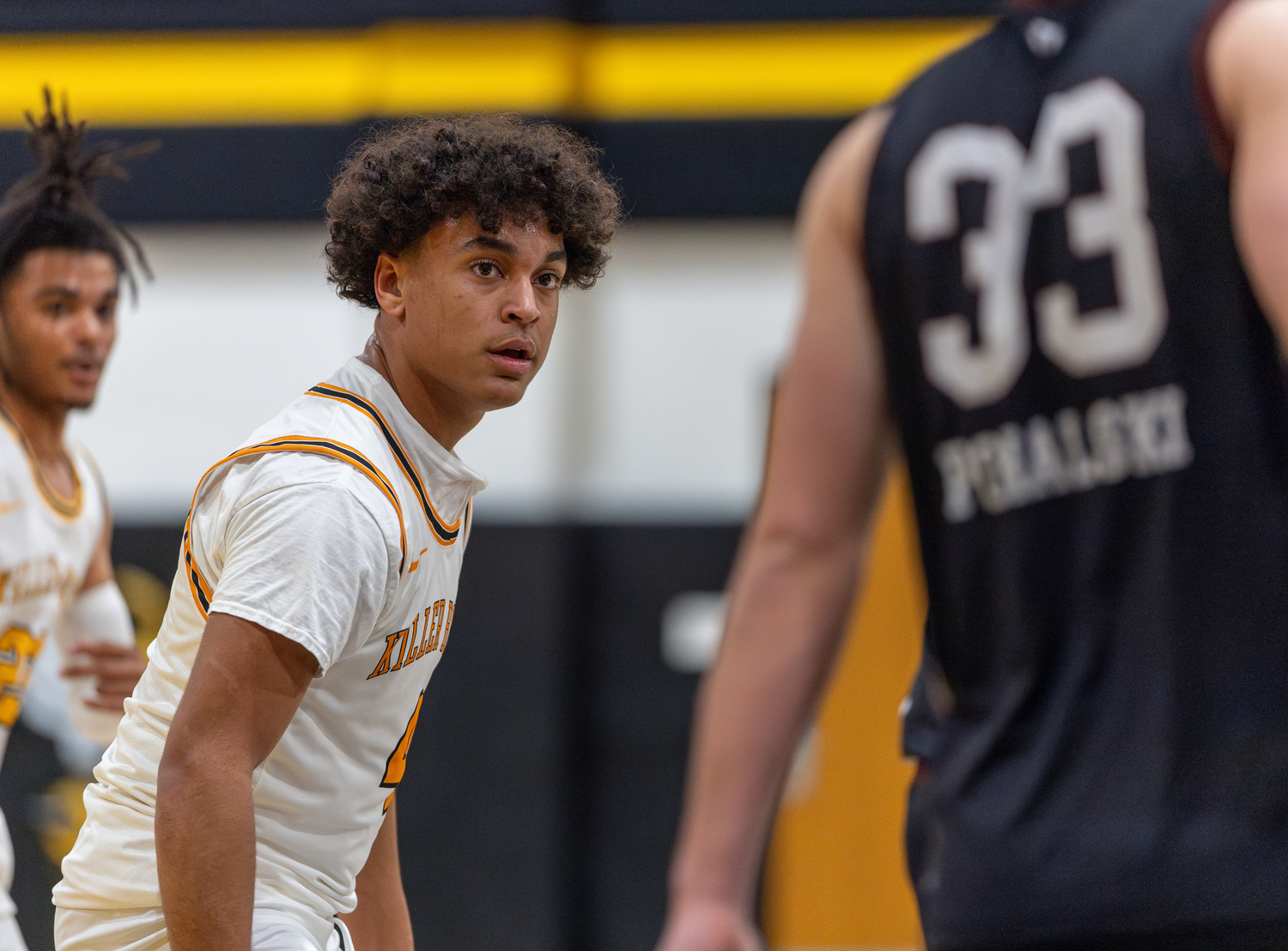 Bridgehampton junior Alex Davis keeps a keen eye on Matthew Pohalski, who with help from his teammates, limited to just nine points on Friday night.  RON ESPOSITO