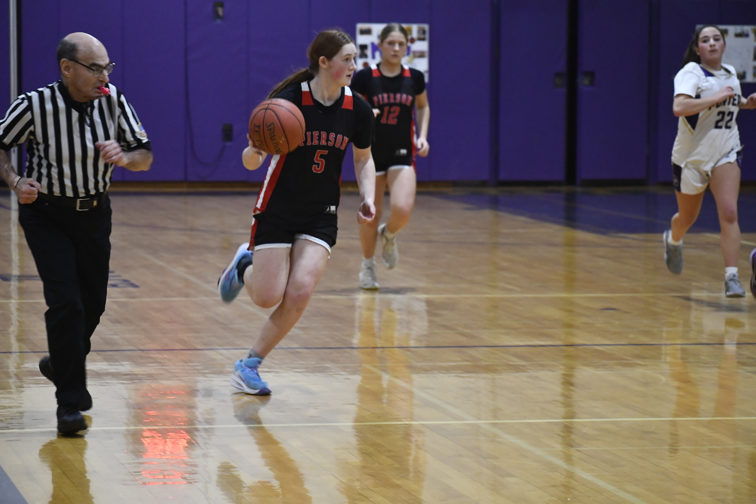 Josie Mott races the ball down the court. 
DREW BUDD