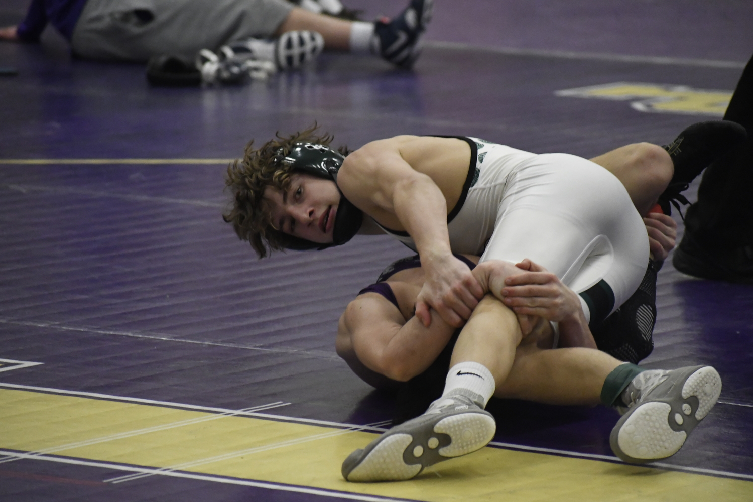 Dylan Blenk takes a quick time check while having Islip's Nico Fallacaro down on the mat.  DREW BUDD