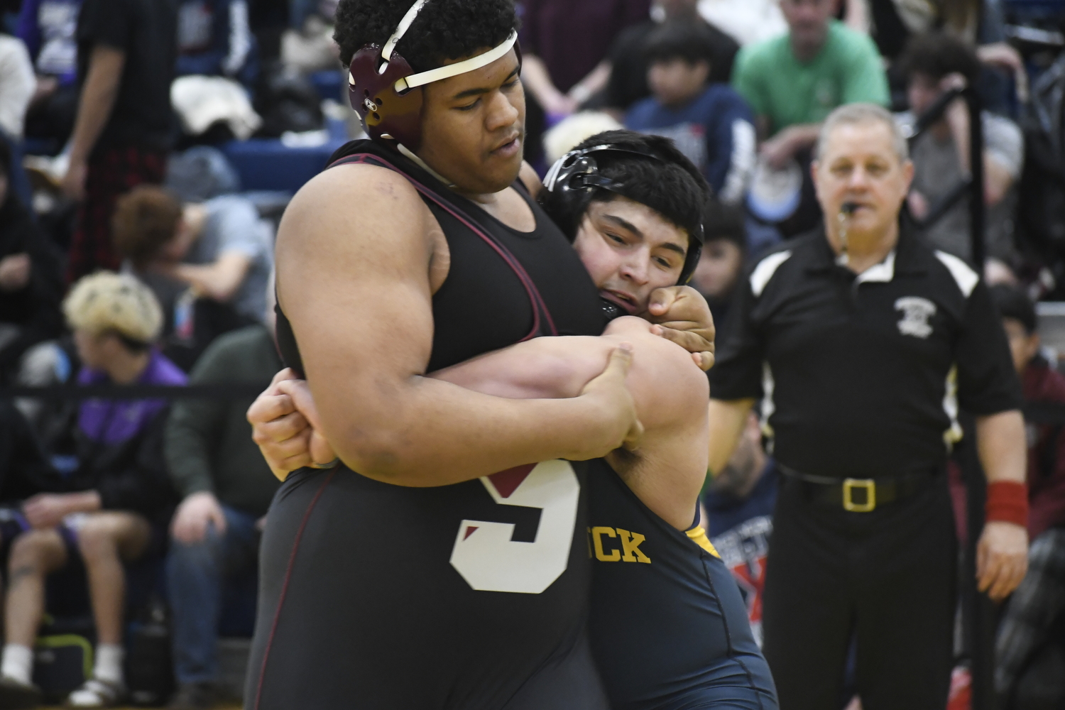 Jackson Garcia tries to muscle Mattituck's Joseph Martocchia to the mat.    DREW BUDD