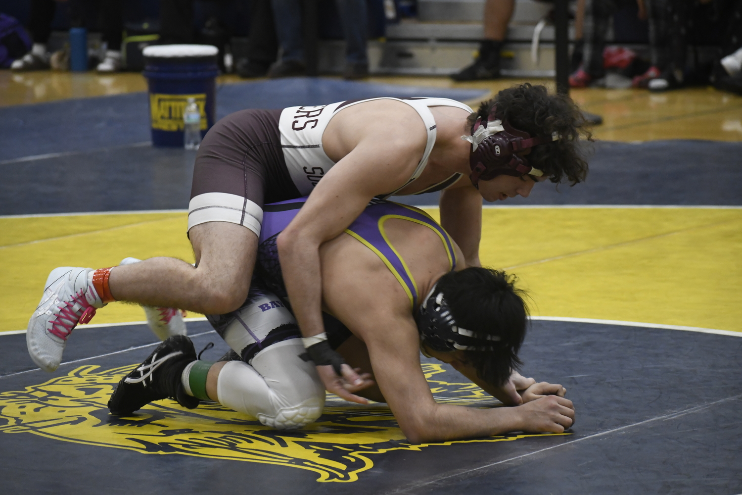 Liam Squires works on top of Angel Valverde of Hampton Bays.   DREW BUDD