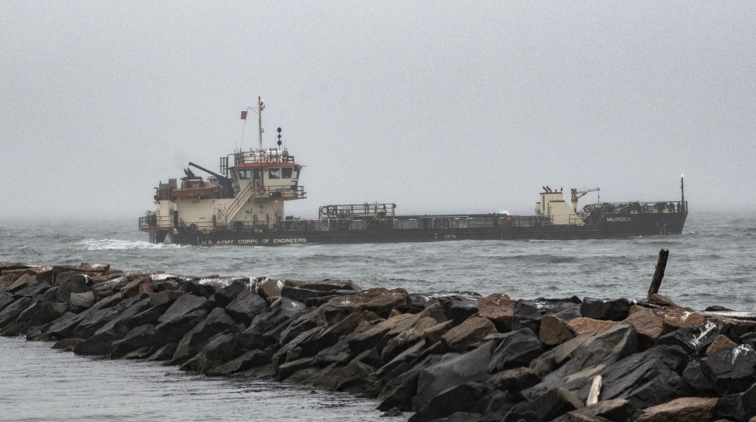 The dredge Marden from The Army Corps of Engineers continues to dredge the inlet to Lake Montauk on Sunday.  DOUG KUNTZ