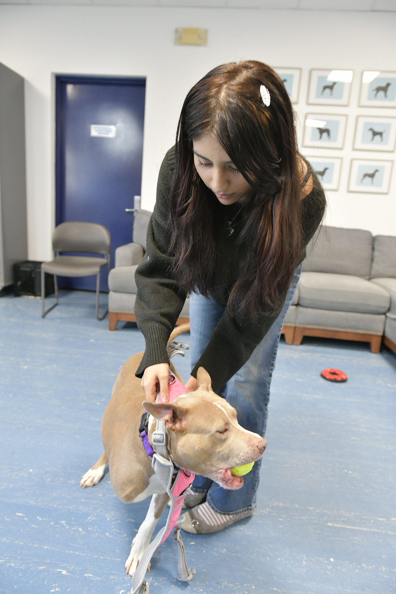 Sarah works with Tryla to get a good fit for her prothstetic leg.  DANA SHAW