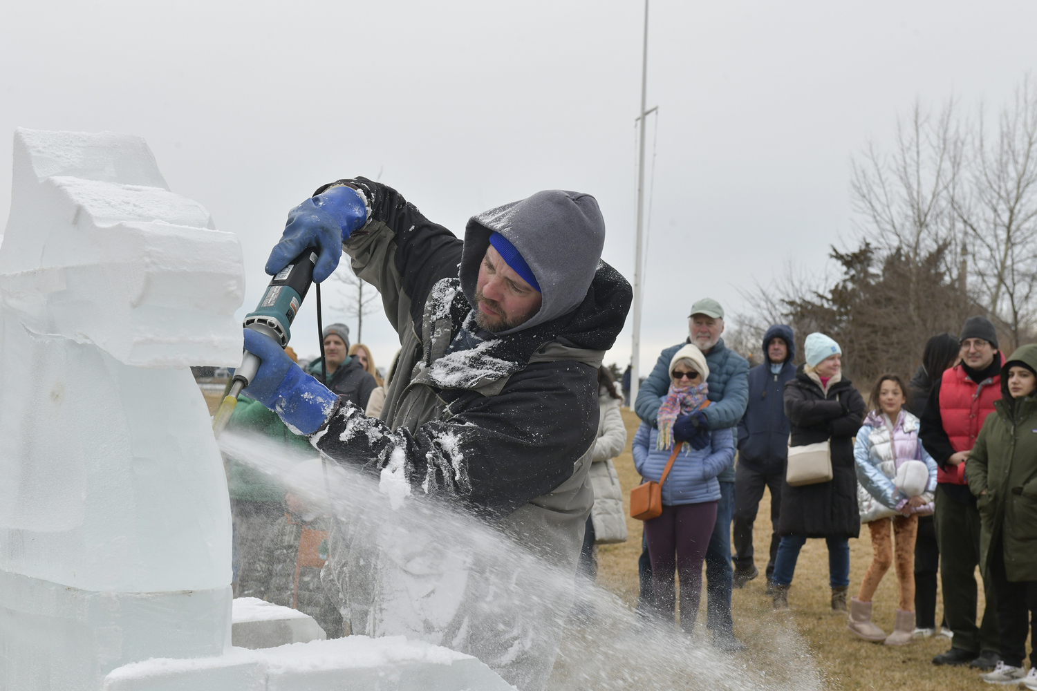 Richard Daly of Ice Memories creates at carving in Steinbeck Park.  DANA SHAW