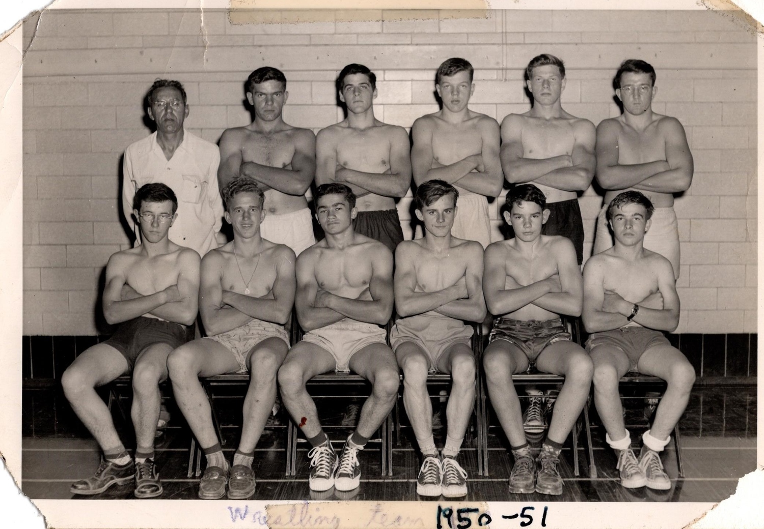 John Strong, second from the right in the front row, was a wrestler in high school, circa 1950. COURTESY LARA STRONG