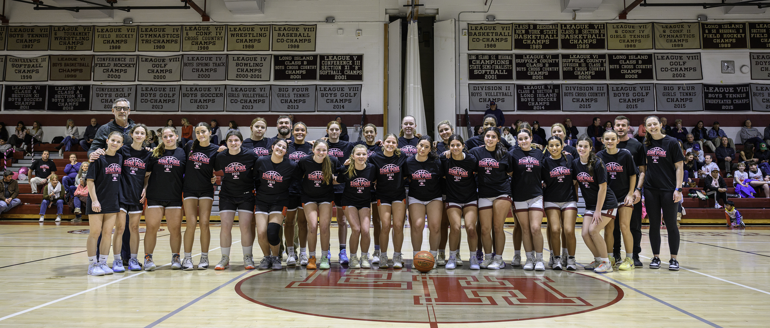 The East Hampton and Pierson girls basketball teams stand in solidarity on Saturday in promoting and fundraising for the Katy's Courage Foundation.   MARIANNE BARNETT