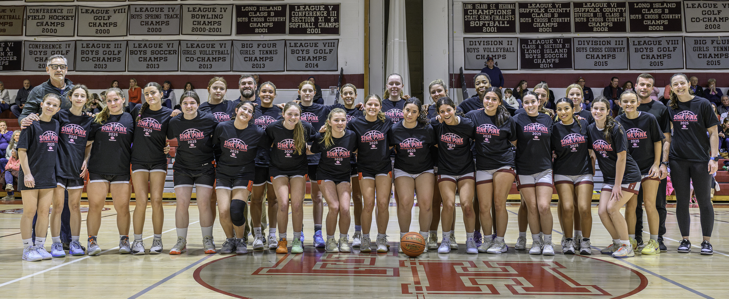 The East Hampton and Pierson girls basketball teams stand in solidarity on Saturday in promoting and fundraising for the Katy's Courage Foundation.   MARIANNE BARNETT