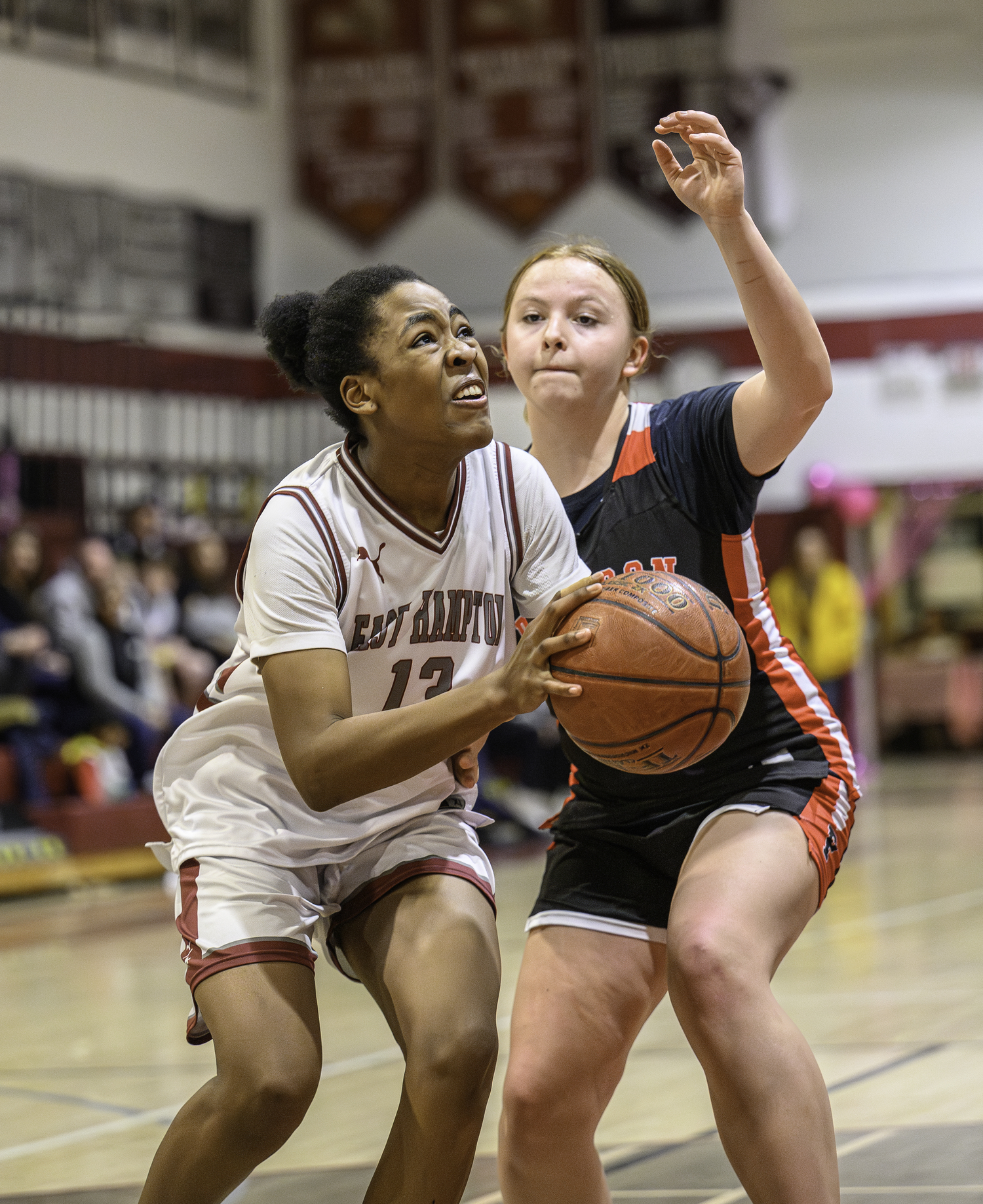 East Hampton's K.K. Moore tries to score around Pierson's Ani Bedini.  MARIANNE BARNETT