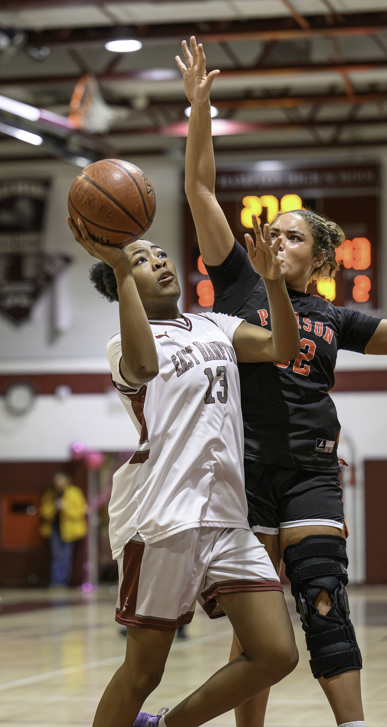 East Hampton's K.K. Moore makes a move around Pierson's Skye Smith.  MARIANNE BARNETT