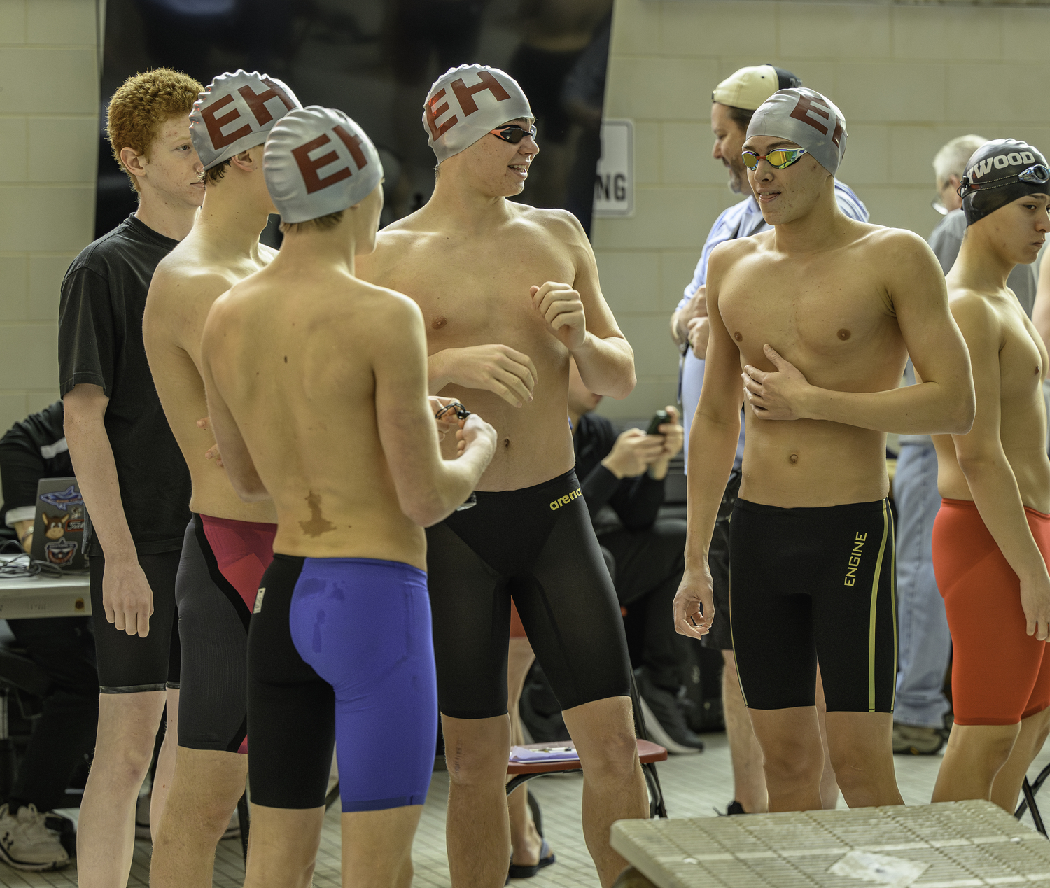 Liam Knight, Jasper Samuelson, Dylan Knapik and Zeb Ryan await the start of the 200-yard freestyle relay on Saturday.   MARIANNE BARNETT