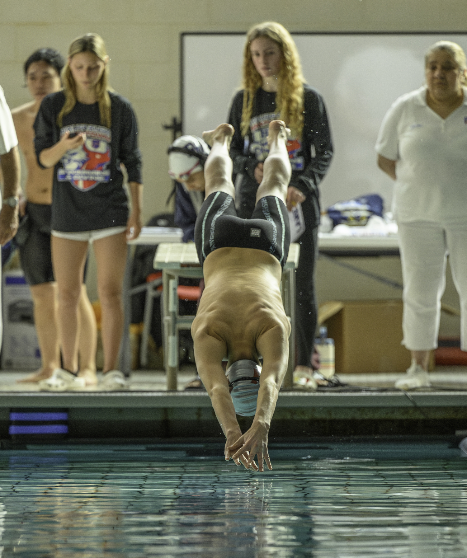 Pierson junior Nick Chavez dives into the pool for the start of the 200-yard individual medley.  MARIANNE BARNETT