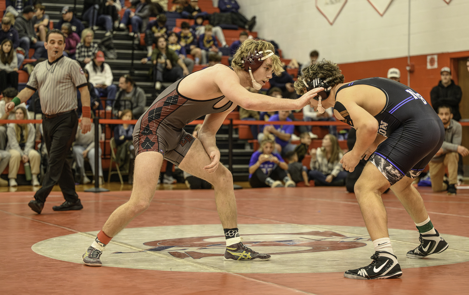 East Hampton senior Adam Beckwith with North Babylon's Luca Turano in the semifinals.   MARIANNE BARNETT