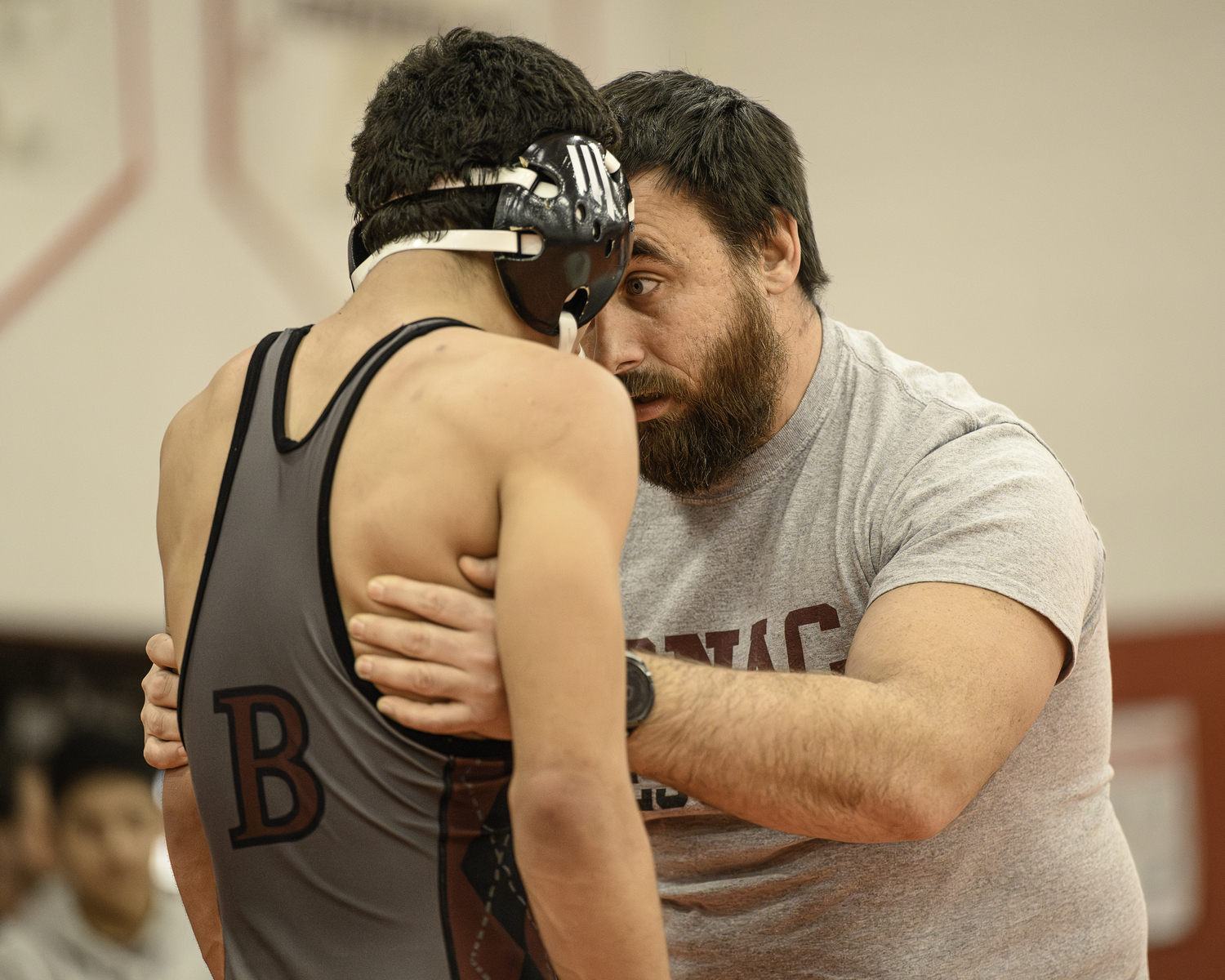 Bonac head coach Ethan Mitchell tries to his keep his wrestler Josue Elias in the match.  MARIANNE BARNETT