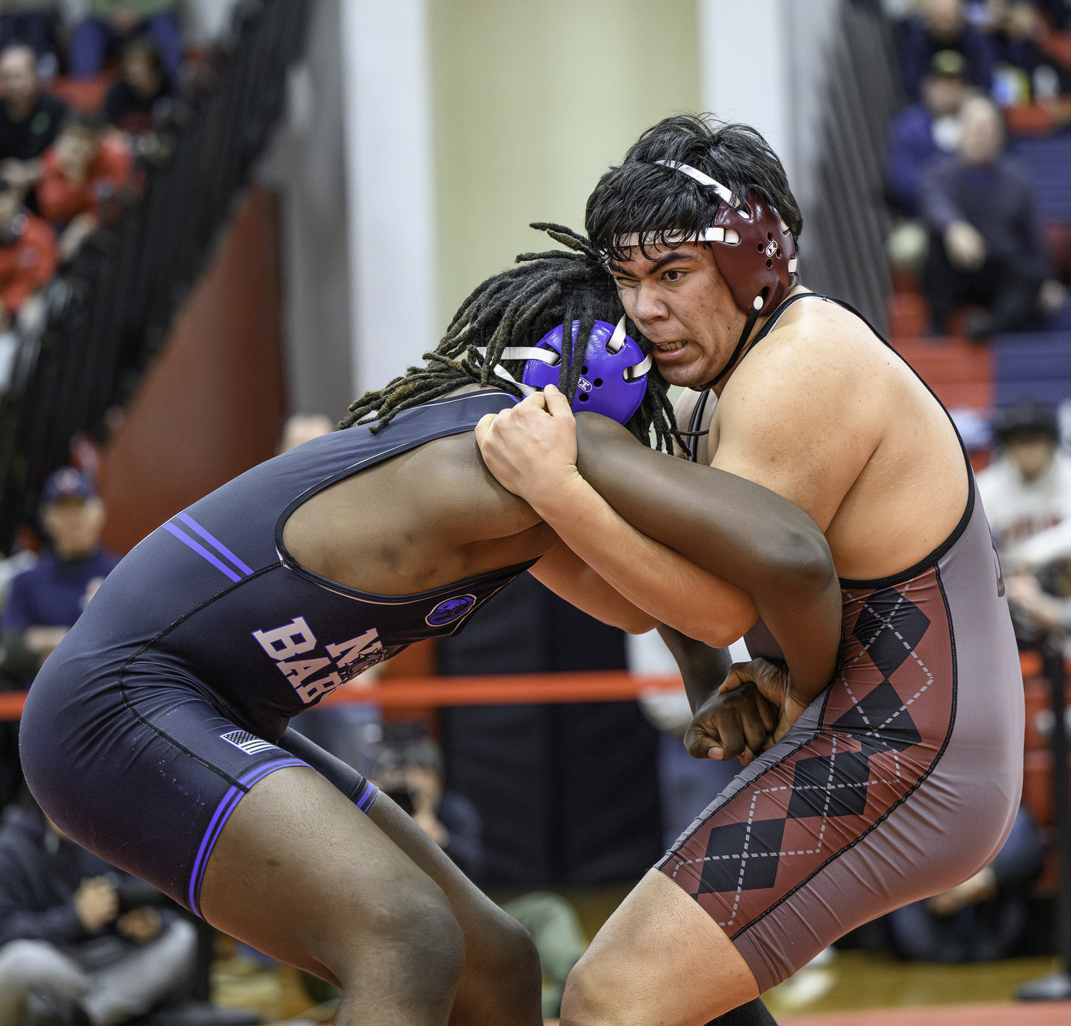 East Hampton junior Juan Espinoza tries to take down North Babylon's Ryan Presume in the semifinals.   MARIANNE BARNETT