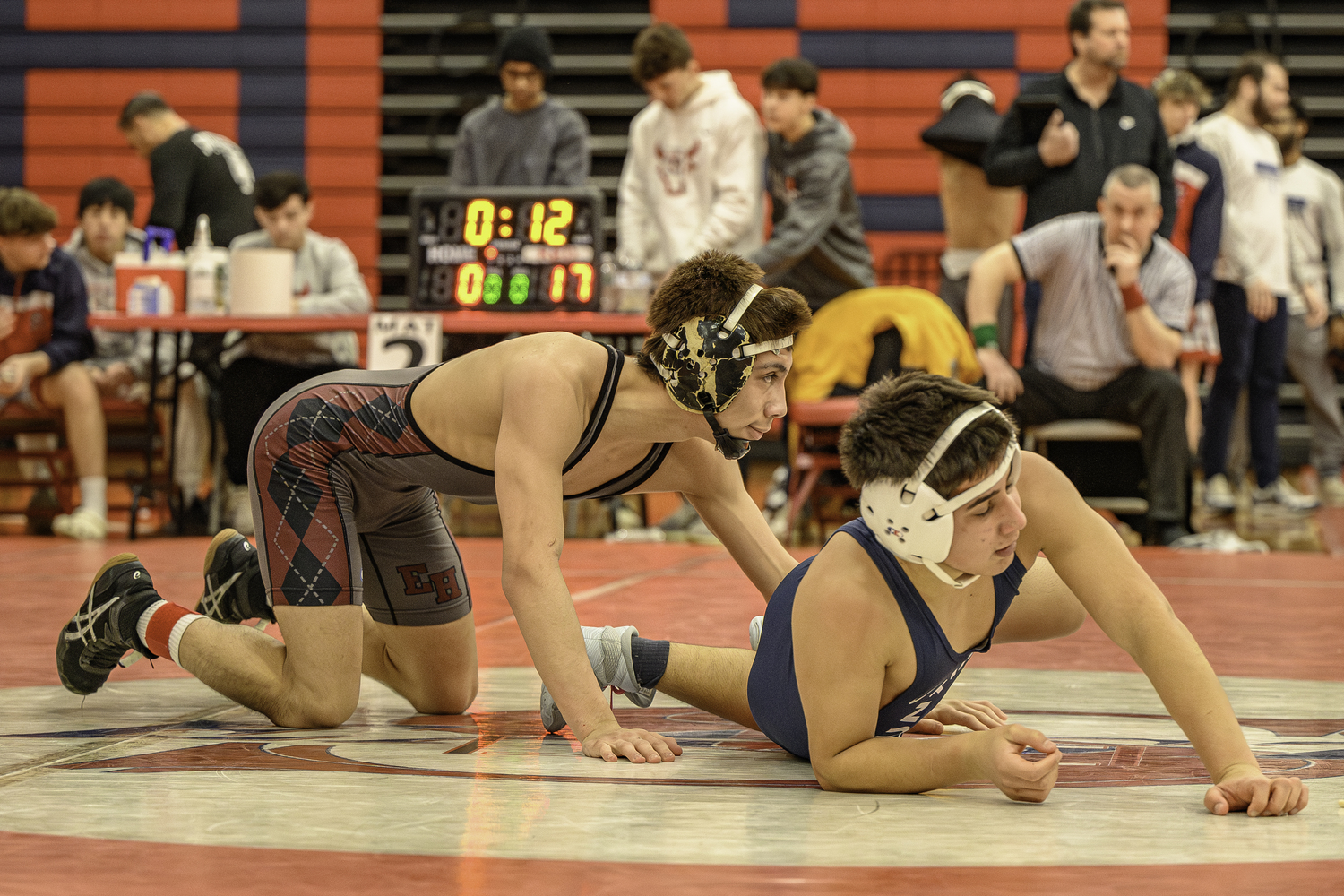 East Hampton senior Juan Roque is happy after his 17-0 tech fall in the semis gets his to the final.  MARIANNE BARNETT