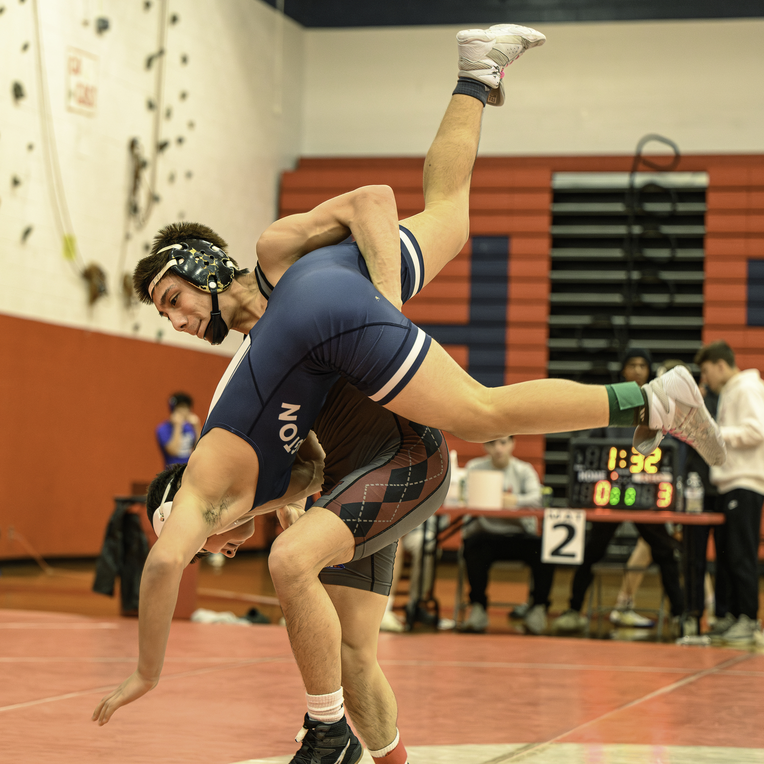 Juan Roque takes down Huntington's Dante Francis.   MARIANNE BARNETT