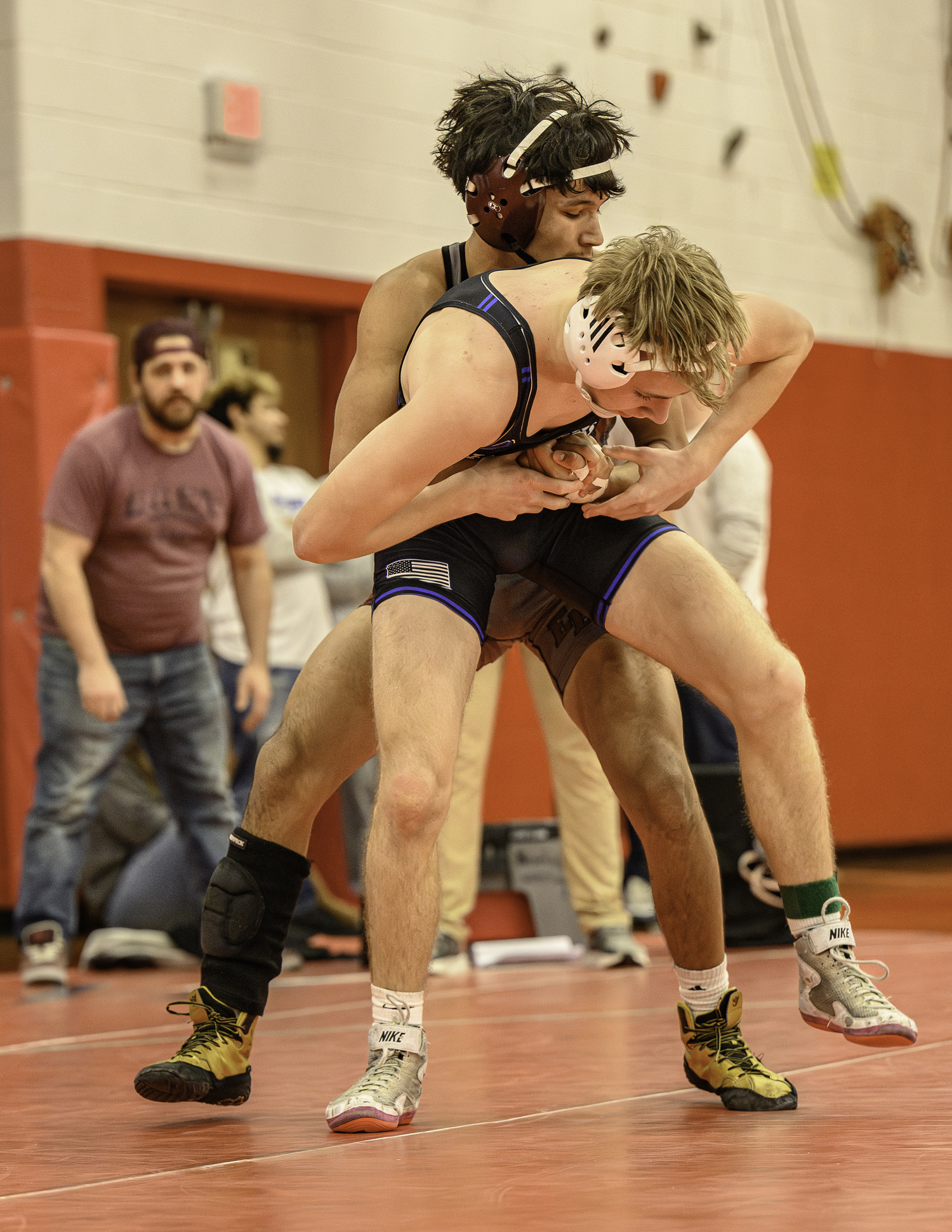 East Hampton's Matias Gonzalez tries to take down North Babylon's Jack Miller.  MARIANNE BARNETT