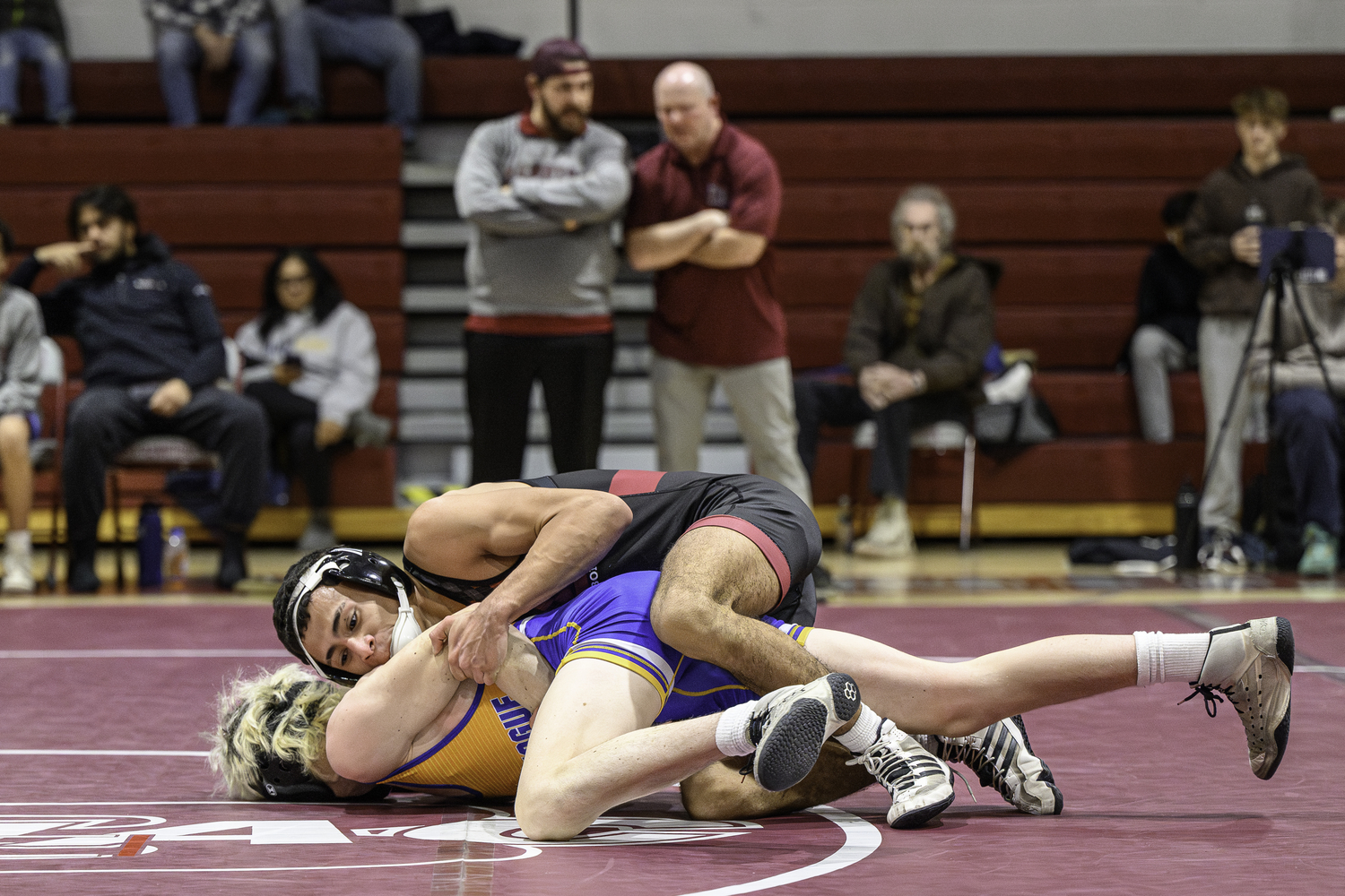 East Hampton senior Josue Elias works against Comsewogue's Collin Schmalz.  MARIANNE BARNETT