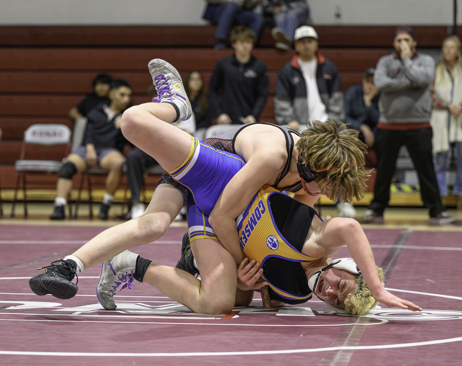 Bonacker Caleb Mott takes Comsewogue's Ben Freudenberg down to the matt. Mott won a 13-6 decision.  MARIANNE BARNETT