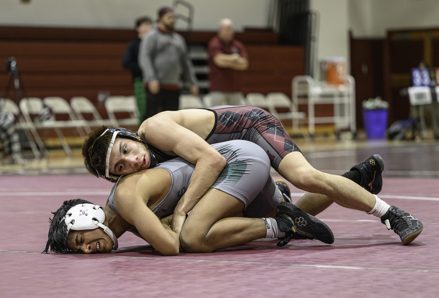 East Hampton senior Juan Roque has top control on William Floyd's David Barrera.   MARIANNE BARNETT