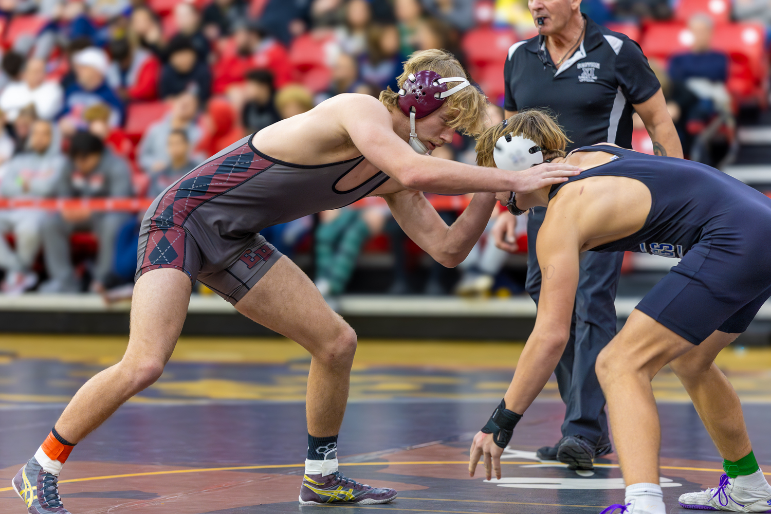 Adam Beckwith works against North Babylon's John Rowland in the consolation finals on Sunday afternoon.  RON ESPOSITO