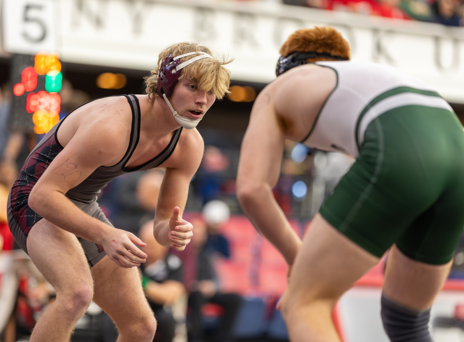 East Hampton senior Adam Beckwith looks for an opening on William Floyd junior David Gonzalez, one of the two wrestlers he faced quite a bit down the season's stretch run.    RON ESPOSITO