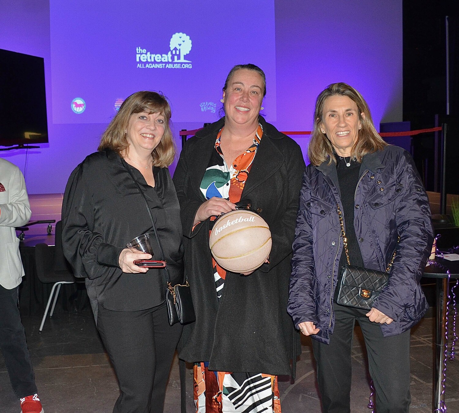 Christina DeSanti, Gene Minskoffand Jenn Fowkes at the Fun-draiser for the Retreat hosted by the Greater East Hampton Chamber of Commerce and LTV at LTV on Thursday.   KYRIL BROMLEY