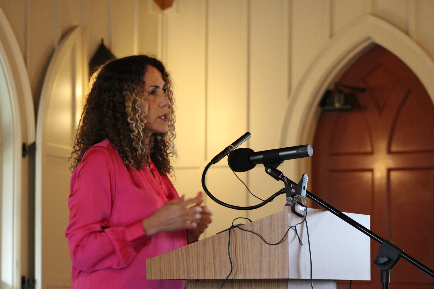 Minerva Perez, the executive director, led a discussion last week at St. Luke's Episcopal Church in which she answered questions about immigration. JACK MOTZ