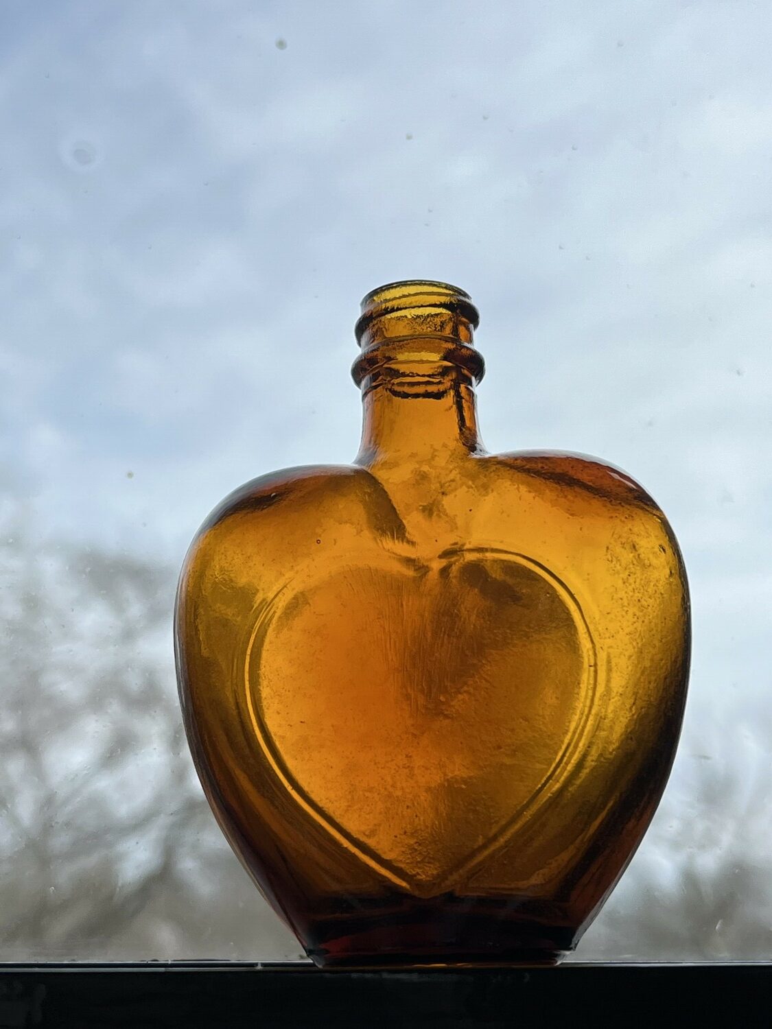 The small, heart-shaped bottle found on the grounds of the Thomas and Mary Nimmo Moran Home and Studio is now part of its collection. STACY MYERS