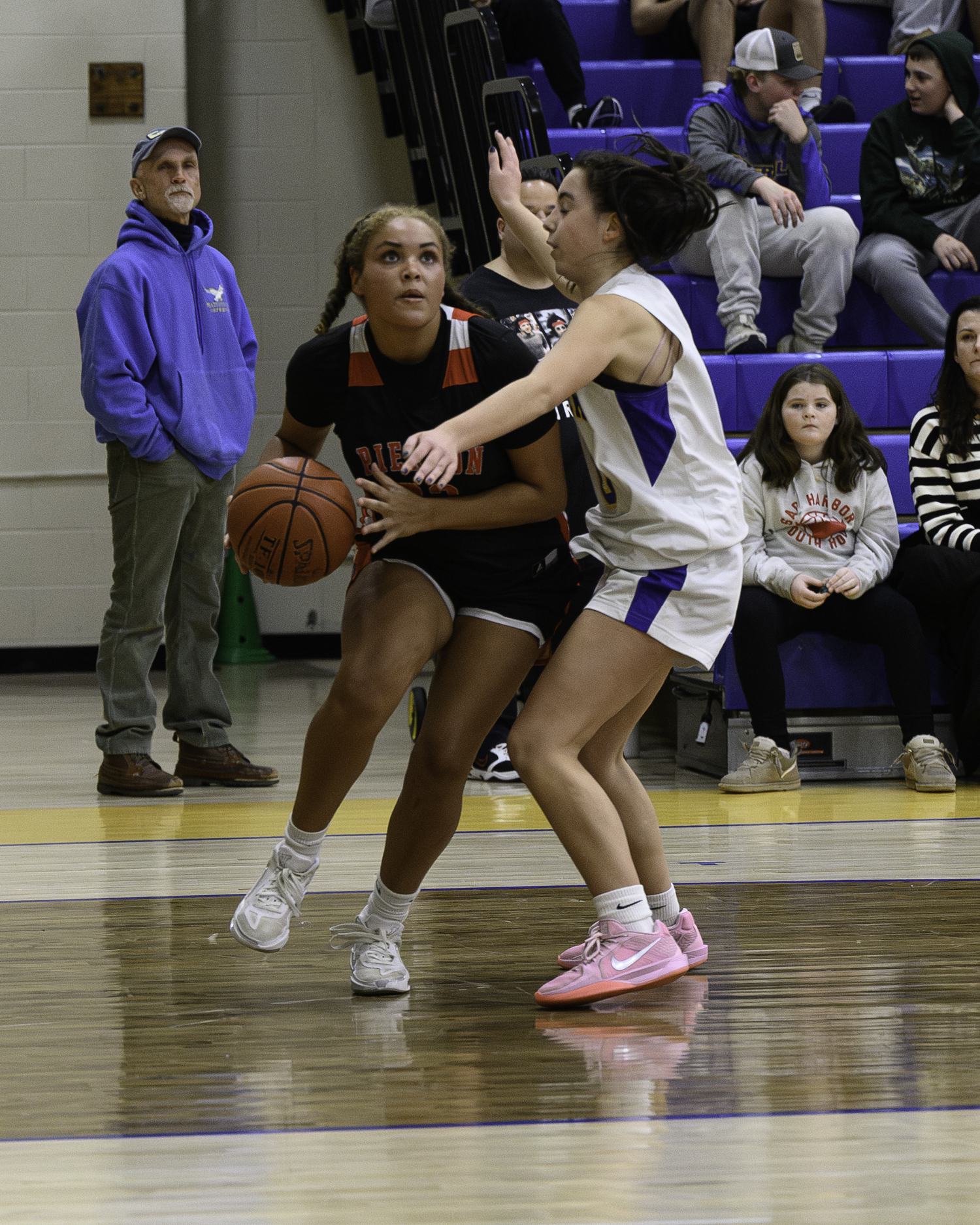 Pierson senior Ani Bedini keeps her eye on the basket as she drives on a Mattituck defender.   MARIANNE BARNETT