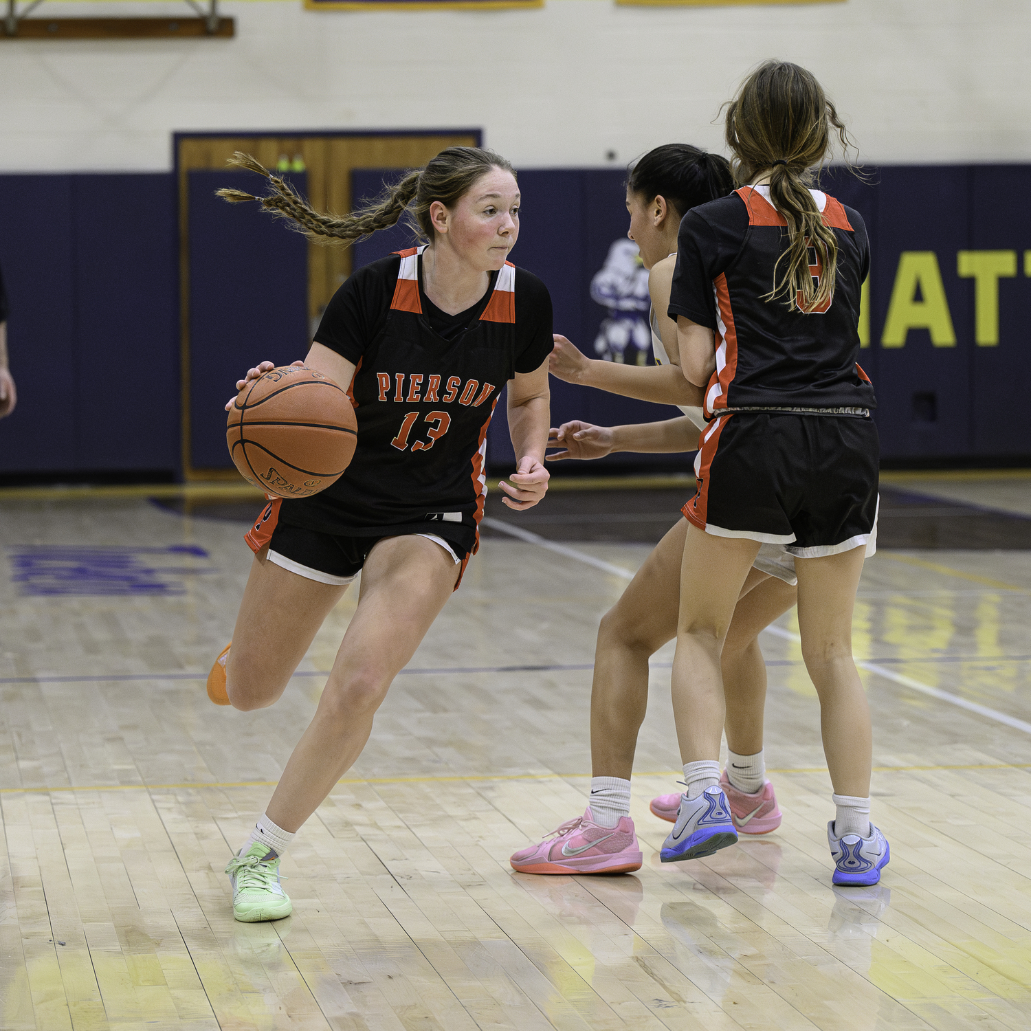 Pierson senior Cali Wilson gets a good pick from freshman teammate Molly Wolfson.   MARIANNE BARNETT