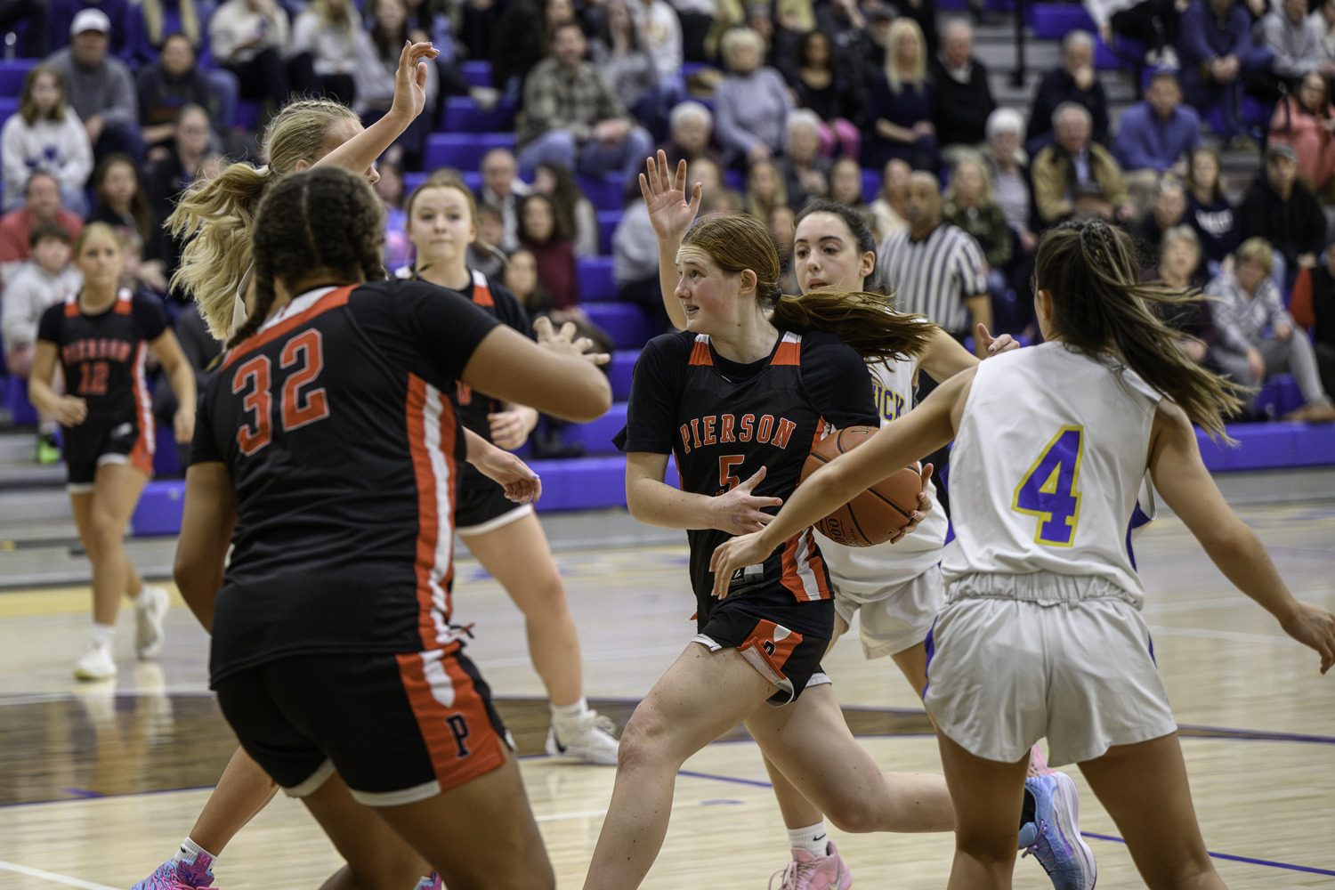 Josie Mott drives to the basket to bring Pierson within two minutes late in the game.  MARIANNE BARNETT