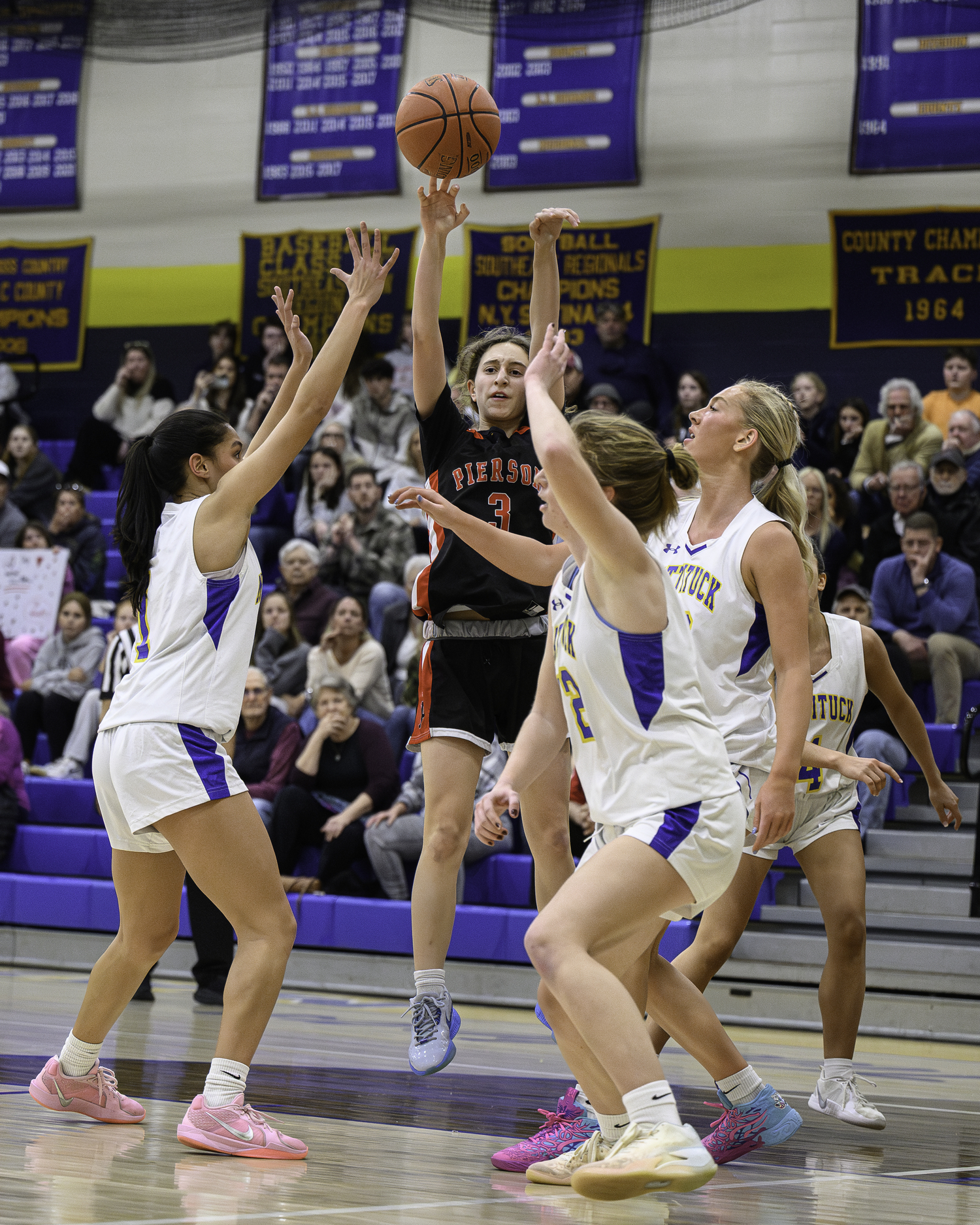 Pierson freshman Molly Wolfson puts up a shot over a number of Mattituck defenders.   MARIANNE BARNETT