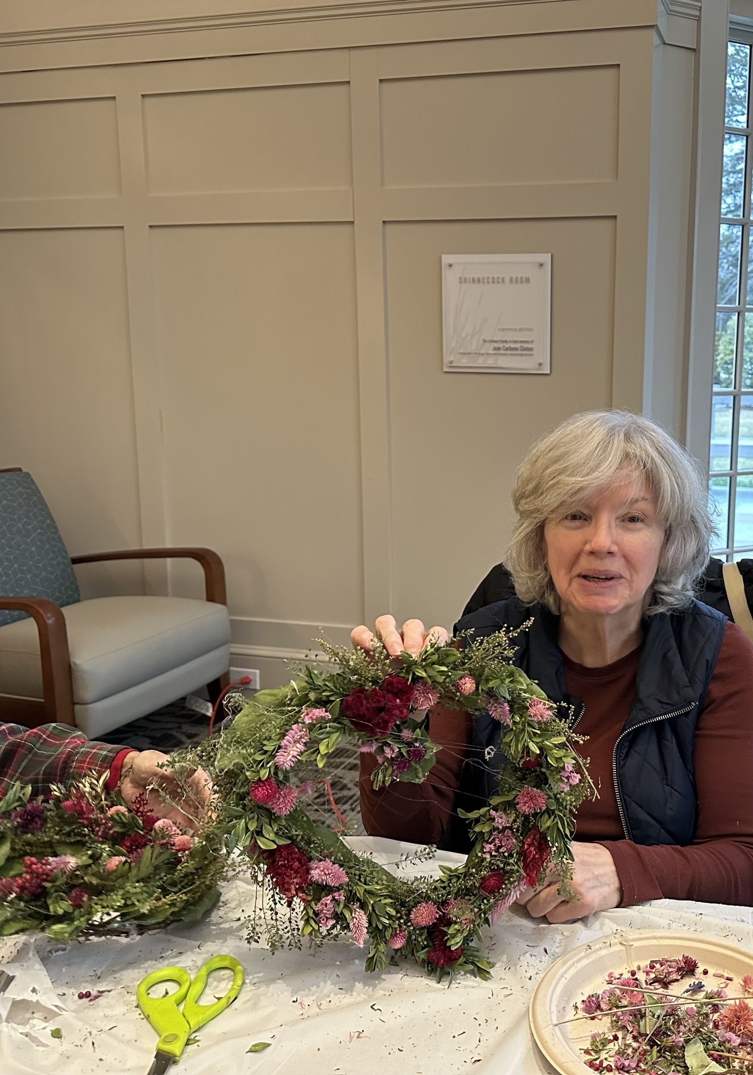 Quogue Library patrons, including Ellen Michna, made dried-flower Valentine Heart Wreaths on February 8. Assorted long-lasting preserved botanical flowers, pods and herbs were provided for each person to make a 12- to 14-inch heart-shaped wreath. COURTESY QUOGUE LIBRARY