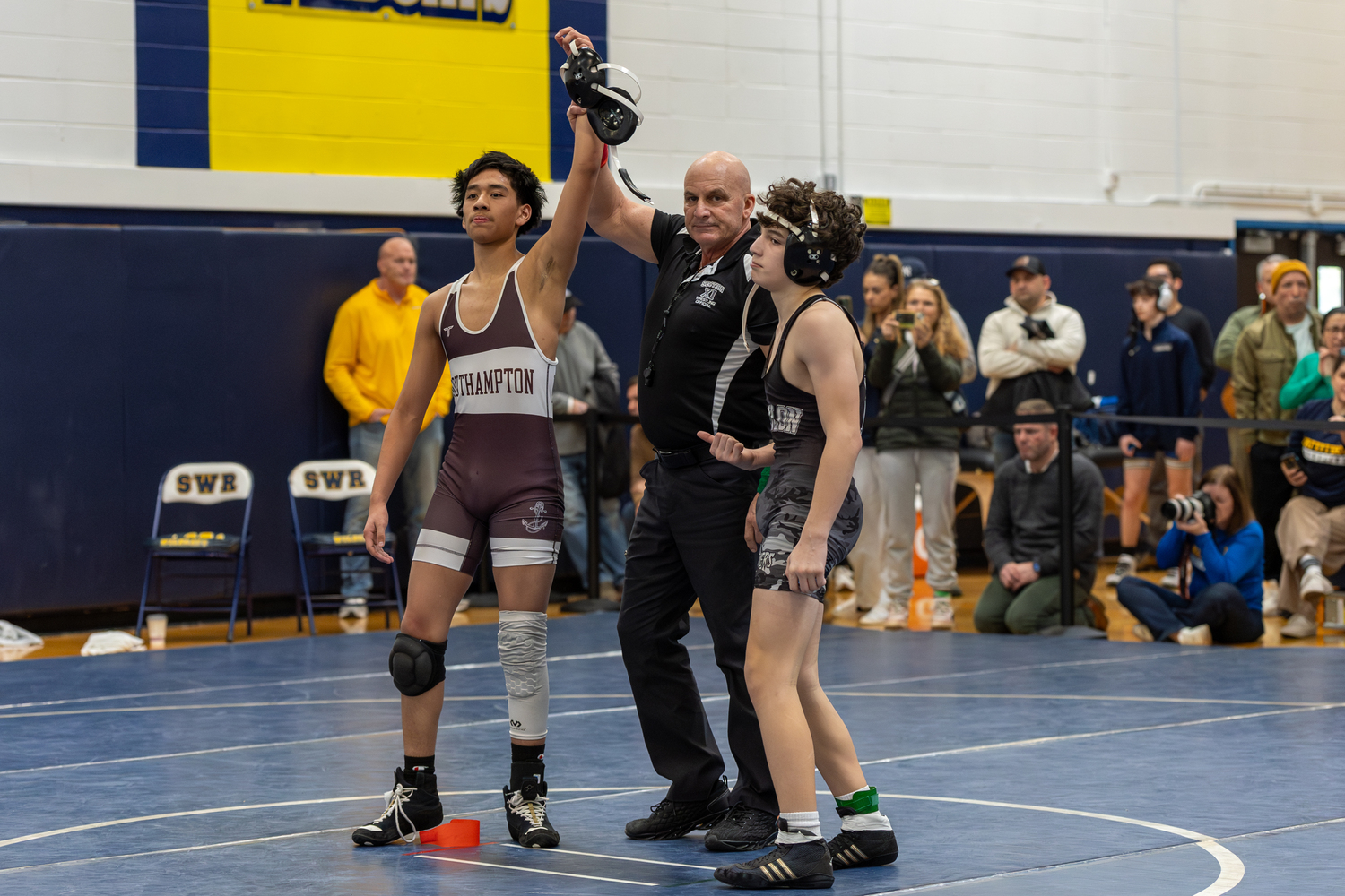 Edward Gaspariano gets his arm raised after a victory.  RON ESPOSITO