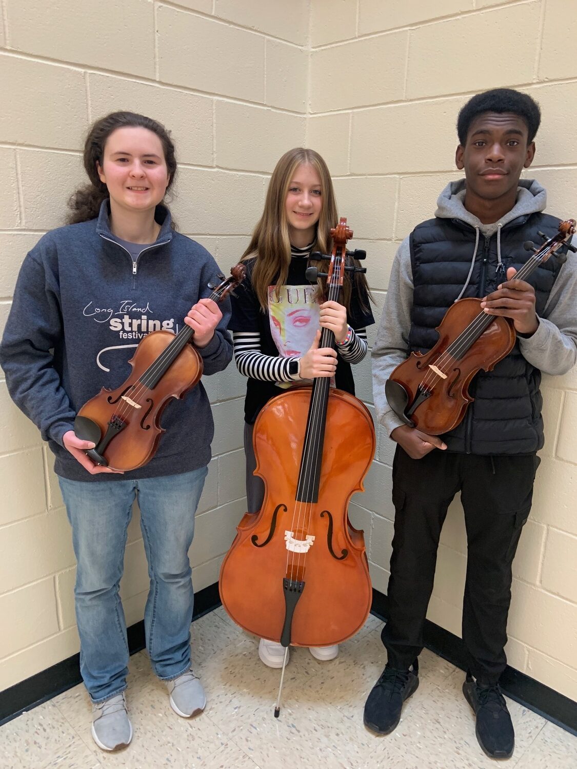 Three Southampton High School students recently represented their school as top string musicians at the Long Island String Festival Association Suffolk Secondary
Festival. The musicians, from left, Chloe Voluck-Sviedrys, Leah Hadyn and Tristyn Sammy, worked closely with world-renowned conductors and performed in concerts at Hauppauge and Northport high schools. COURTESY SOUTHAMPTON SCHOOL DISTRICT