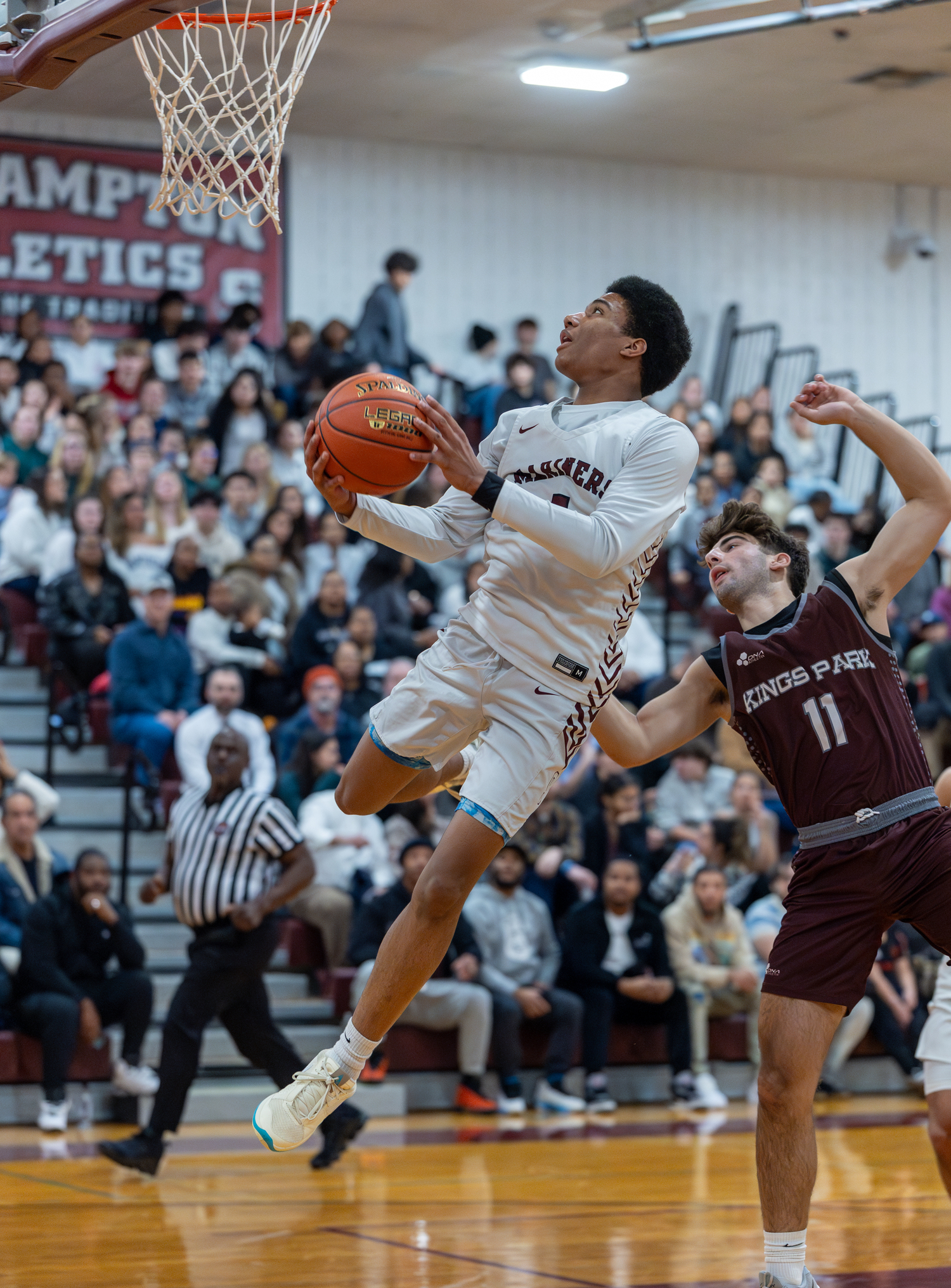 Southampton senior Devon Palmore avoids a Kings Park defender while going up to score.  RON ESPOSITO/SOUTHAMPTON SCHOOL DISTRICT