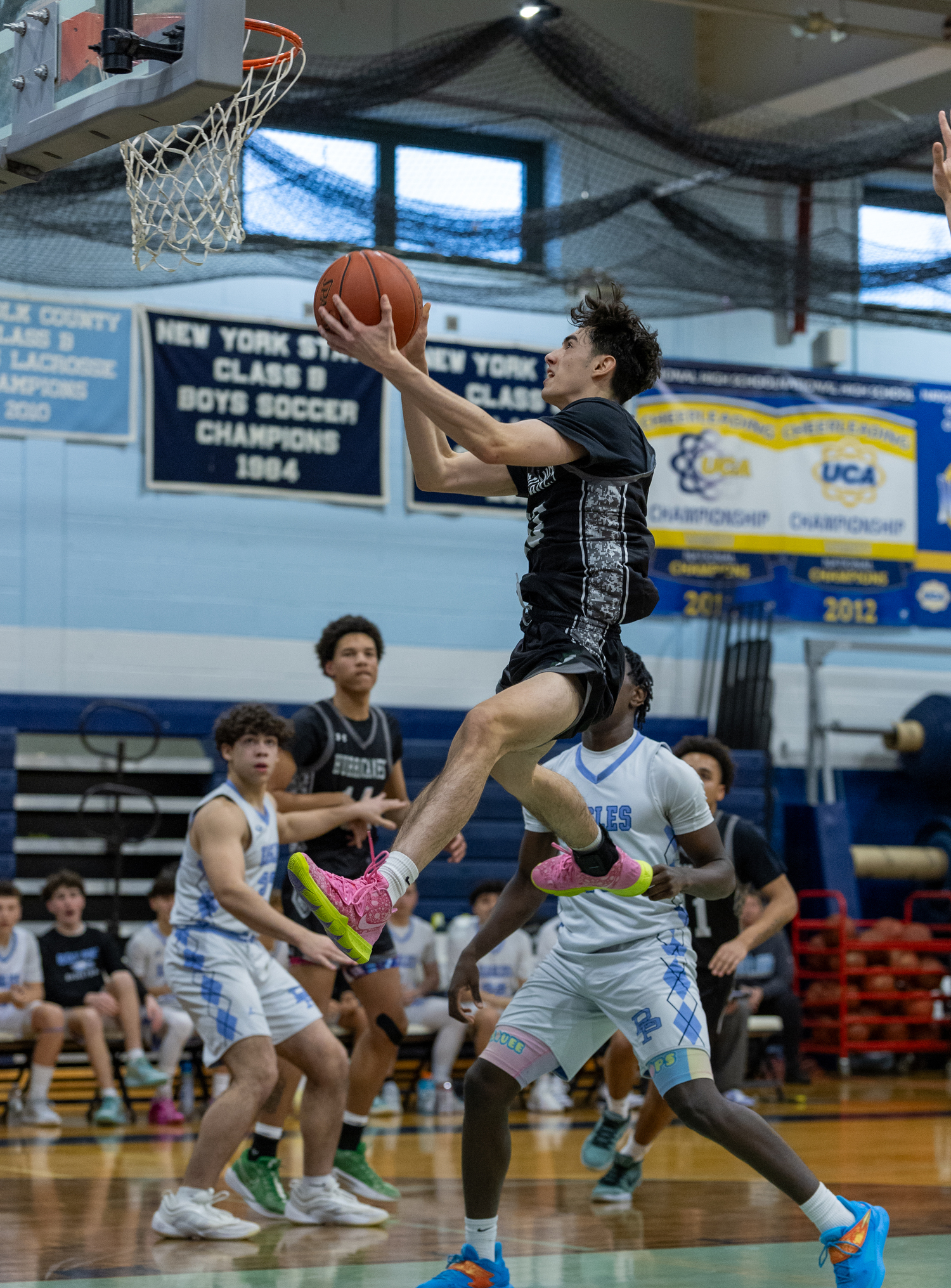 Senior guard Dante Quinones takes it to the rim. RON ESPOSITO