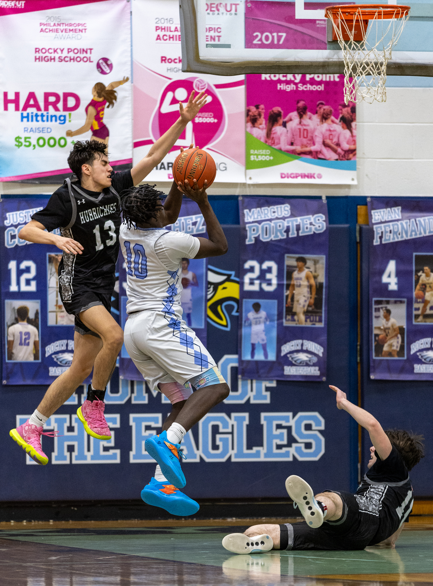 Senior guard Dante Quinones reaches for a block. RON ESPOSITO