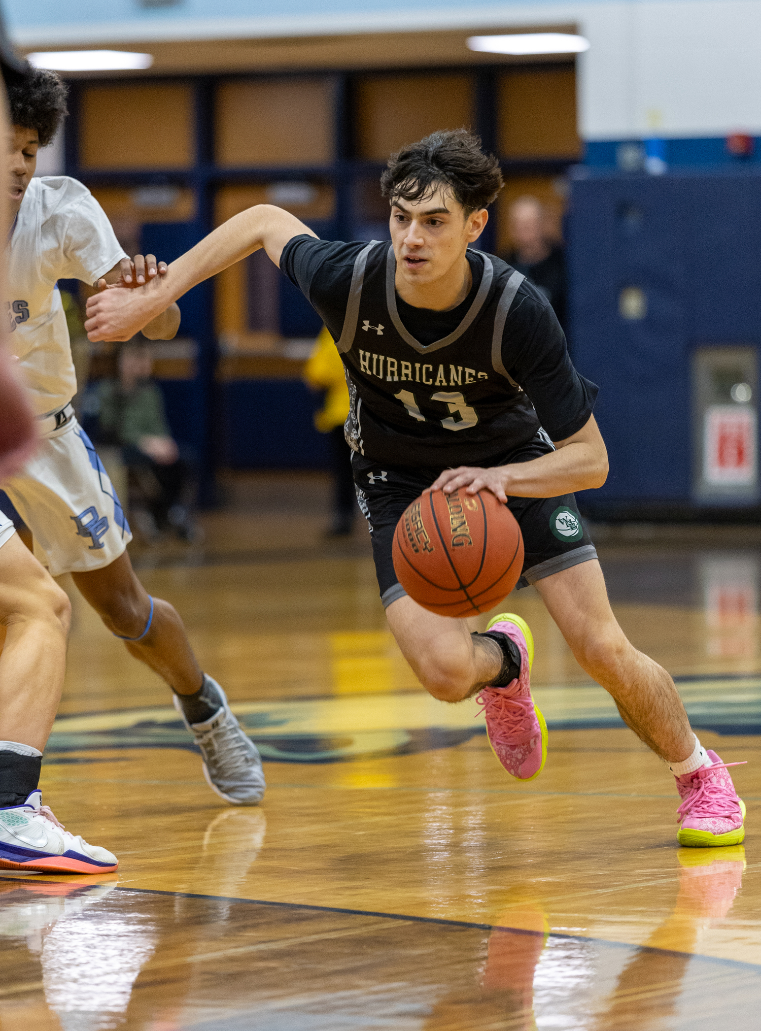 Senior guard Dante Quinones drives toward the basket. RON ESPOSITO