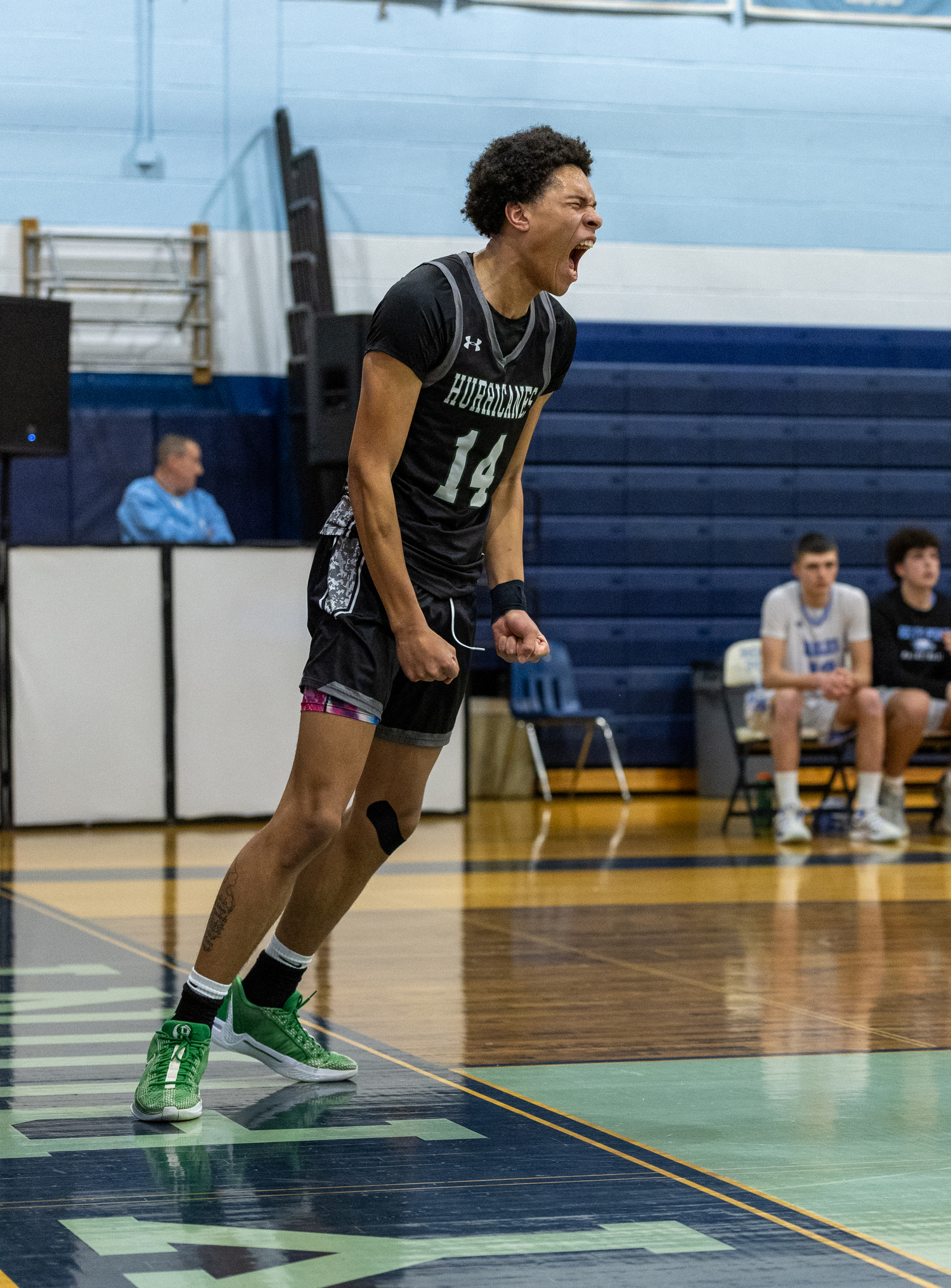 A fire is ignited in senior center Jorden Bennett after his dunk. RON ESPOSITO