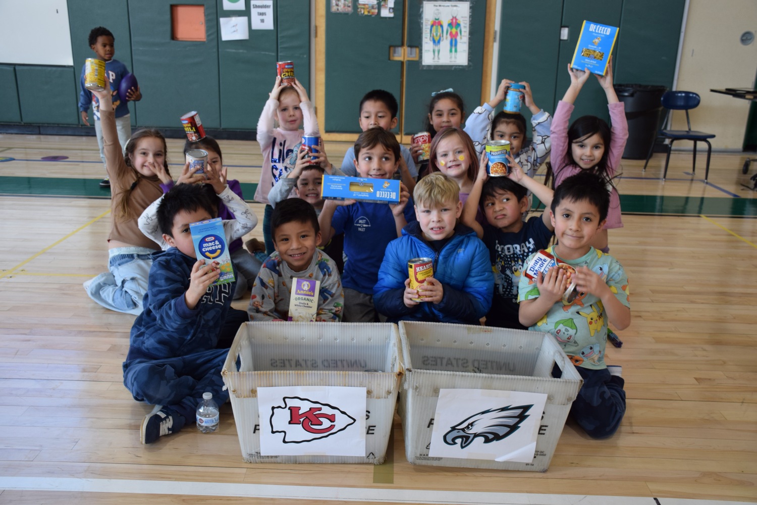 Westhampton Beach Elementary School students made predictions on which team would win Super Bowl LIX through an annual Souper Bowl fundraiser. They used donations of nonperishable goods to vote for the team they thought would win this year’s Super Bowl by placing them in a team bin. The final tally indicated that 74 students guessed the Kansas City Chiefs would win and 53 thought the Philadelphia Eagles would take home the title. All items collected will be donated to local food pantries. COURTESY WESTHAMPTON BEACH SCHOOL DISTRICT